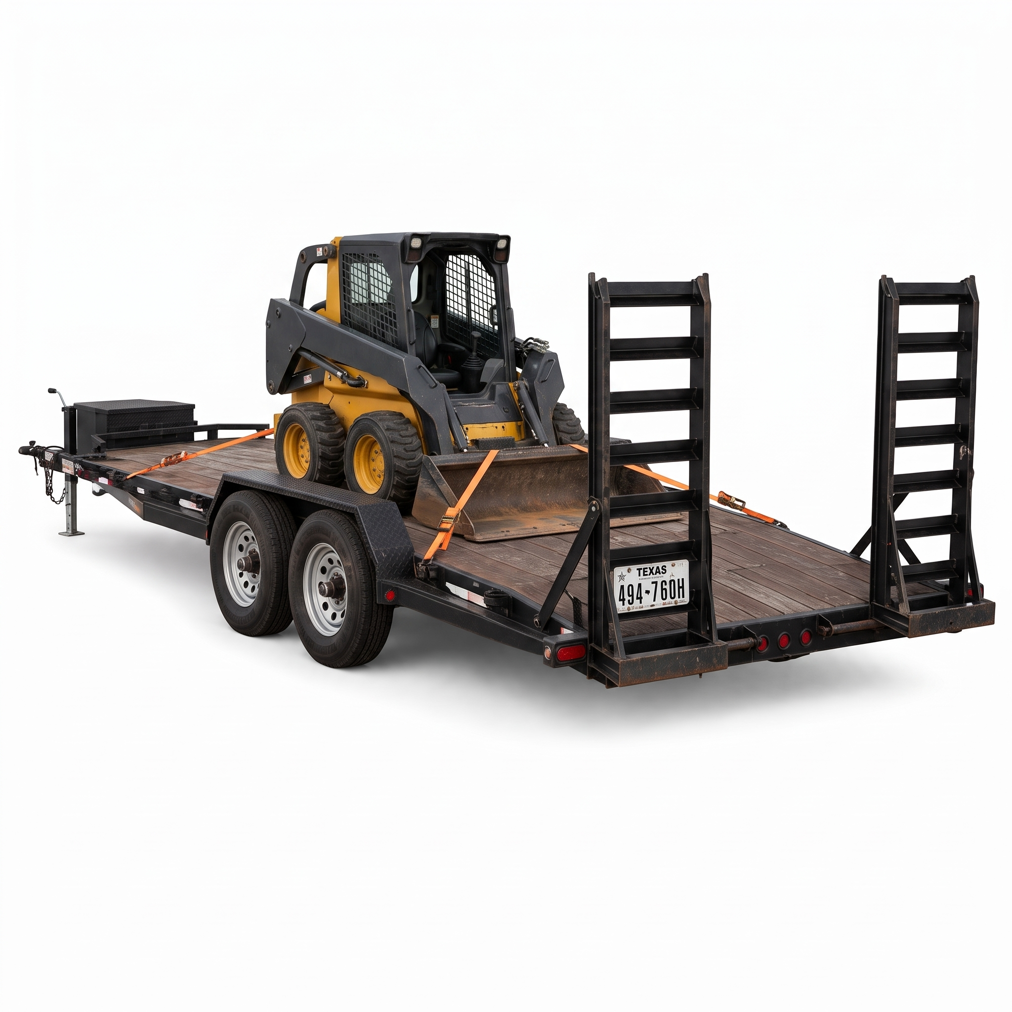 7 by 20 foot car hauler carrying a yellow skid steer loader secured with ratchet straps
