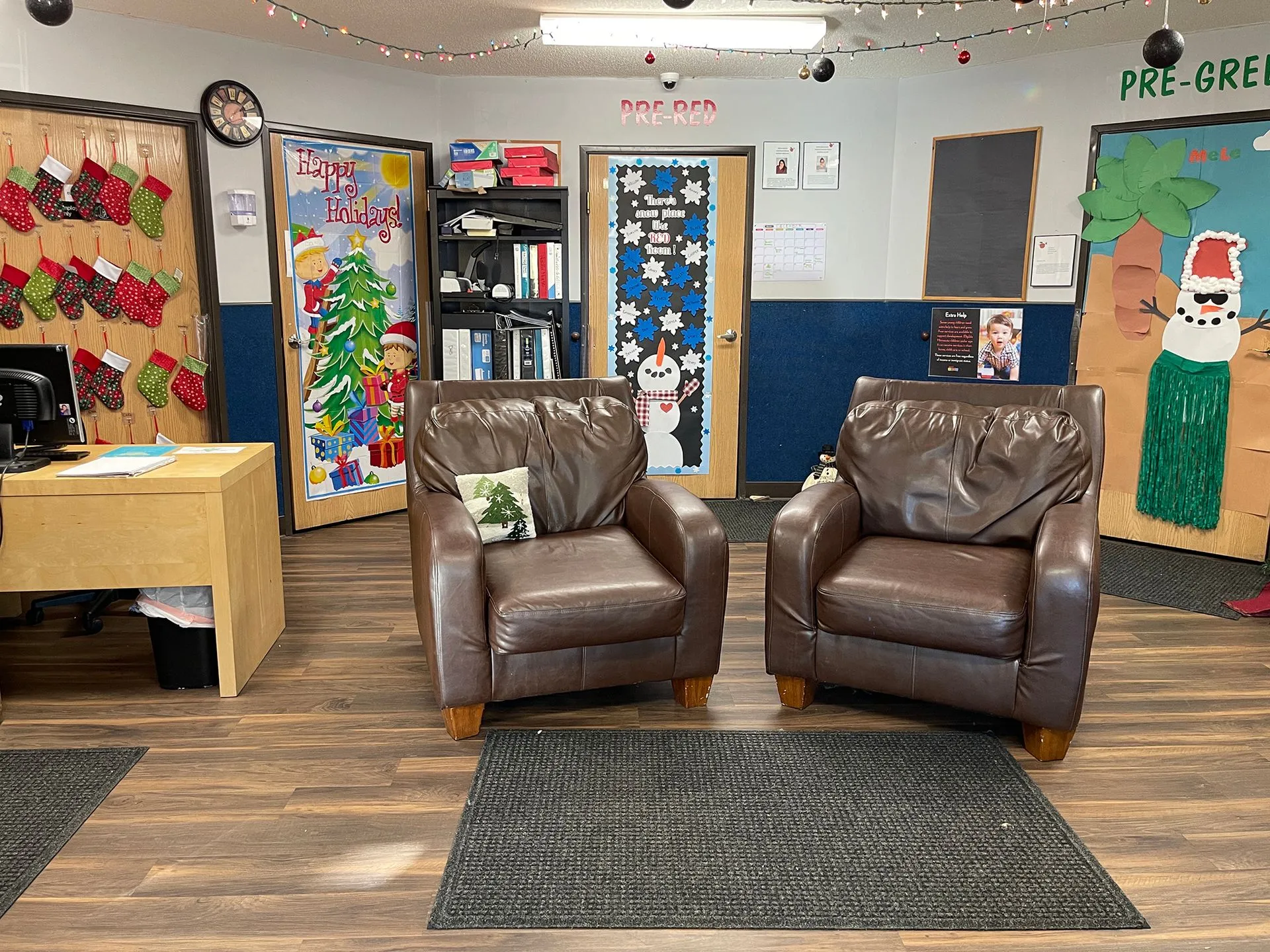 Preschool Red and Green hallway with cozy seating area and cheerful classroom doors