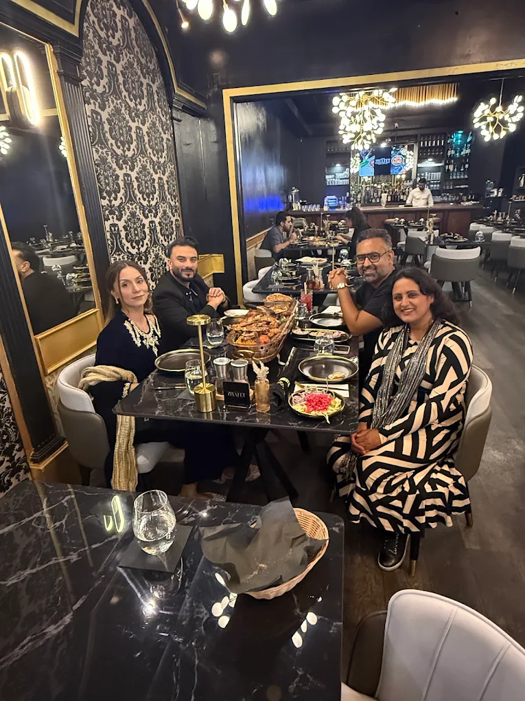 A family gathered around a Turkish feast table at Ziyafet