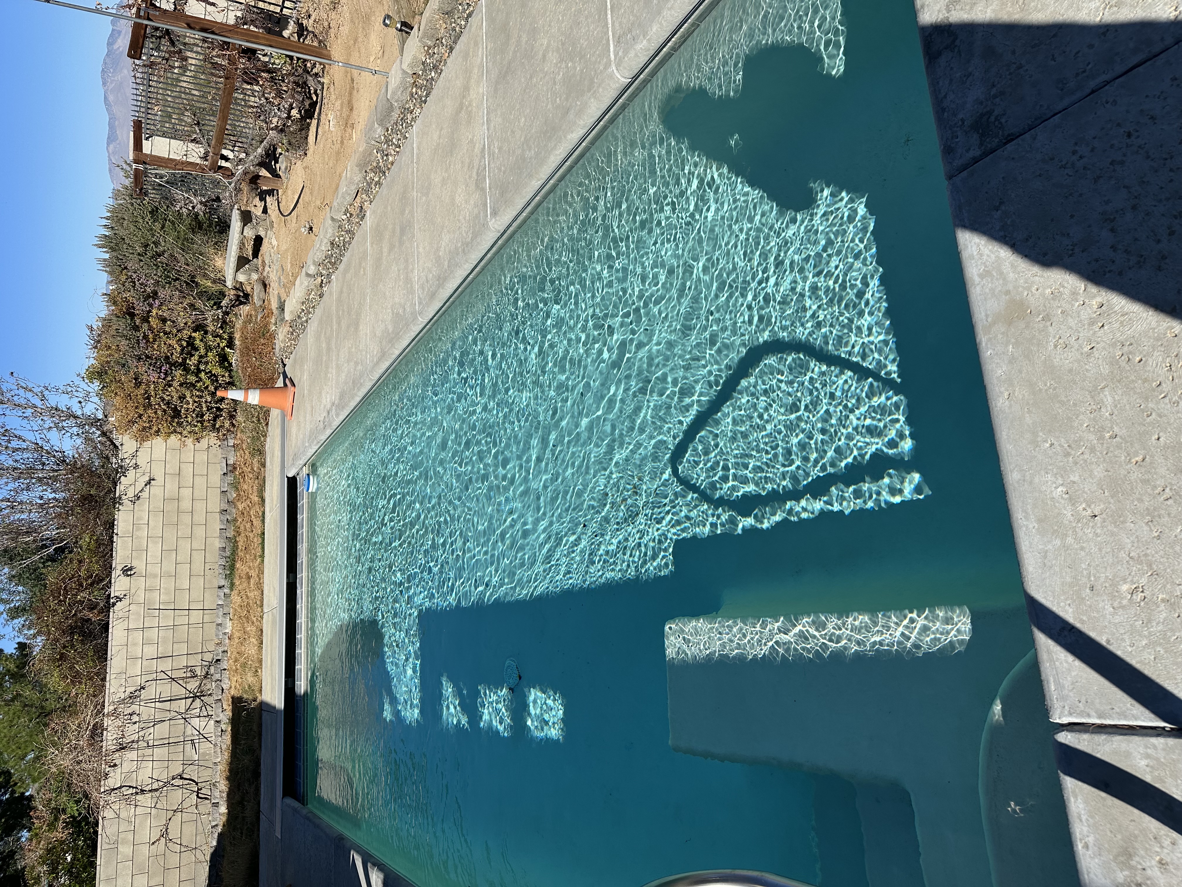 Crystal clear, sanitized blue pool water after Connor Jaeger Pool Service treatment in Ridgecrest, CA