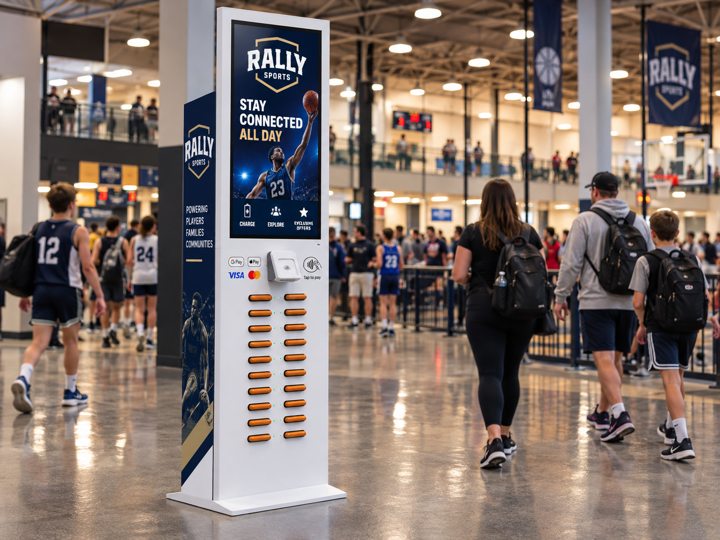 A tall RALLY SPORTS branded charging station in an active indoor sports tournament facility