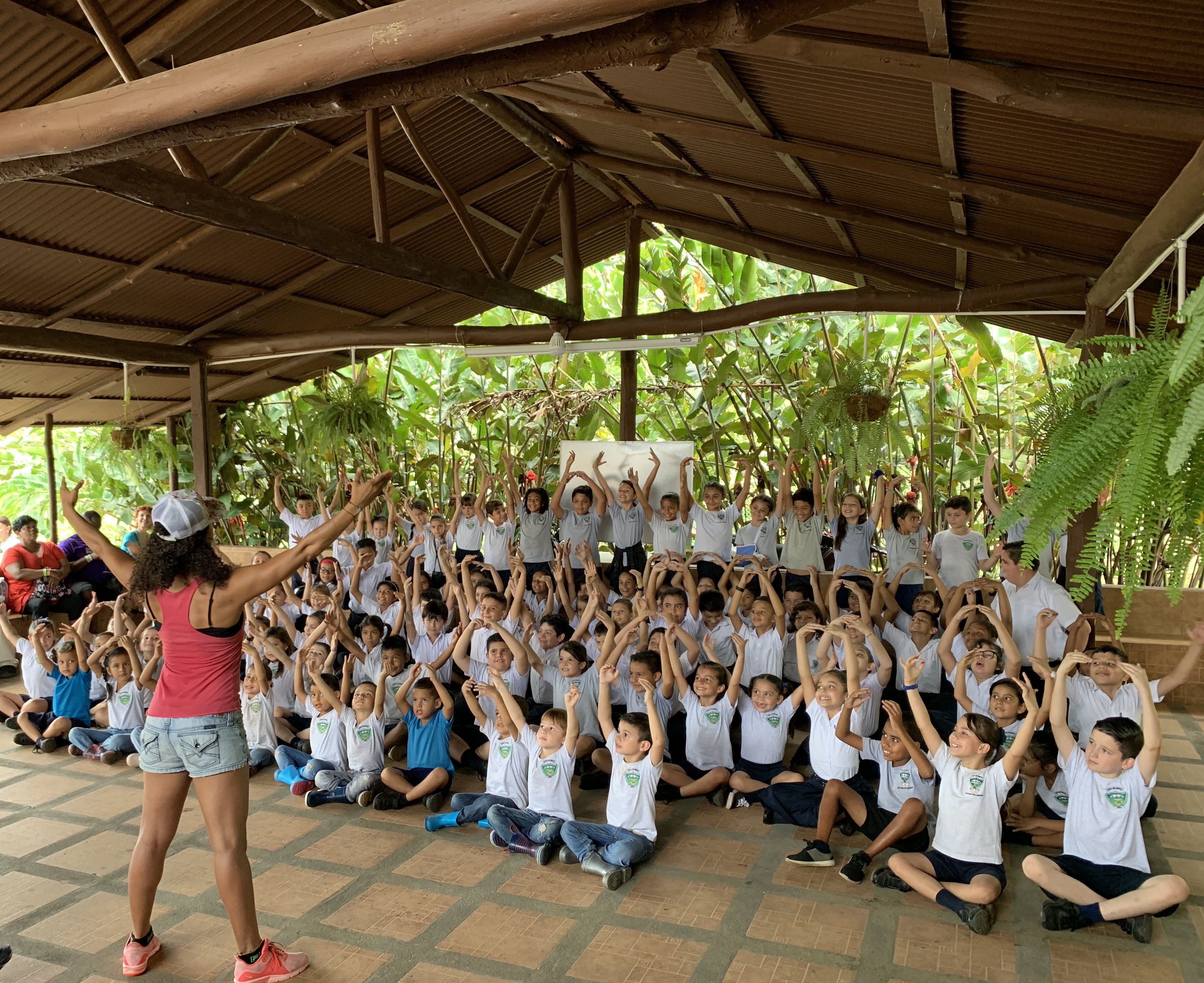 Dominique Robinson directing youth and community program participants during an international education workshop