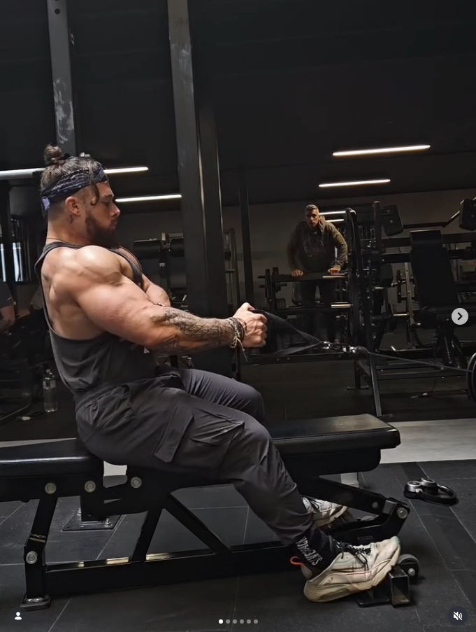 James Alabaster performing seated cable row with focused back contraction