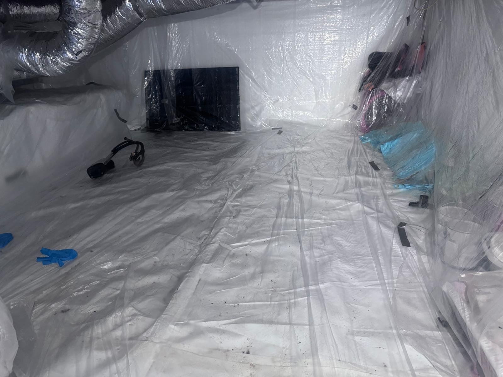 Crawl space vapor barrier installation
