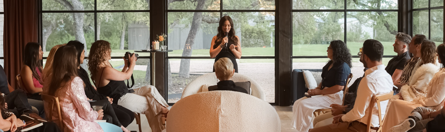 Celinne Da Costa facilitating an in-person immersion and speaking to leaders