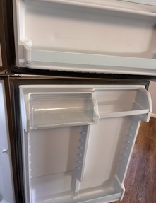 Clean Refrigerator Door Racks & Bins