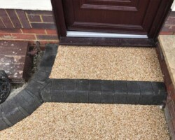 Resin-bound front door entrance path and doorstep with charcoal block edging