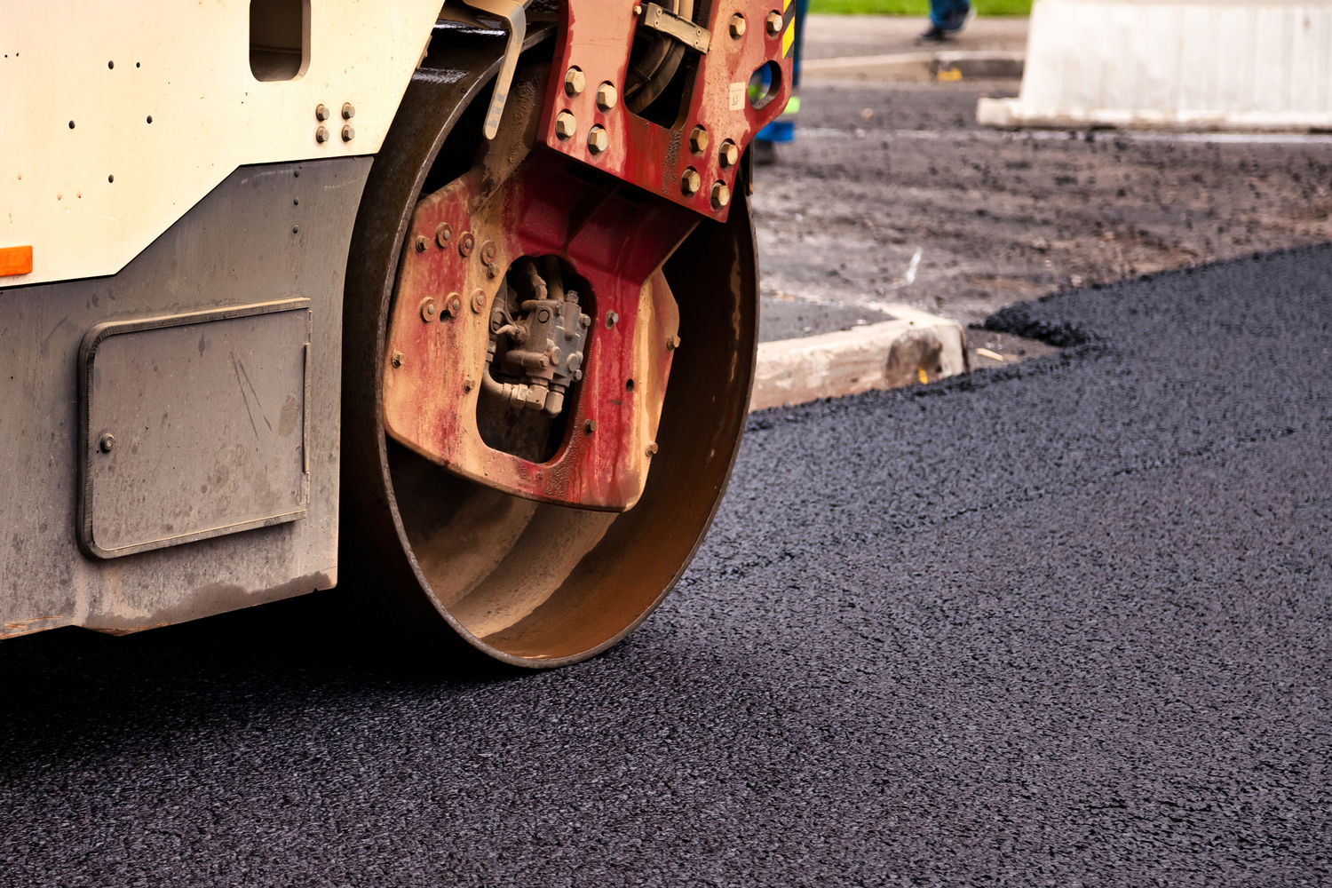 Heavy-duty tarmac roller rolling and compacting smooth fresh tarmac