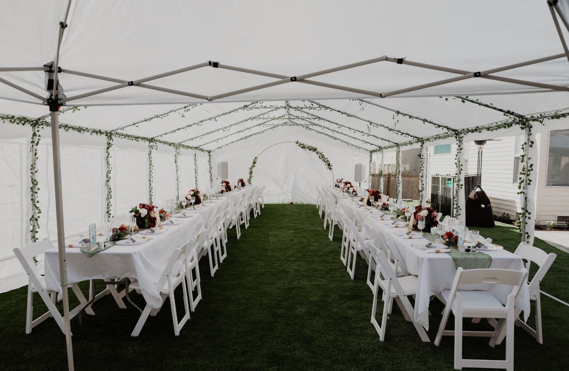 20x40 white party tent rental with decorated banquet tables and seating in Kitsap County