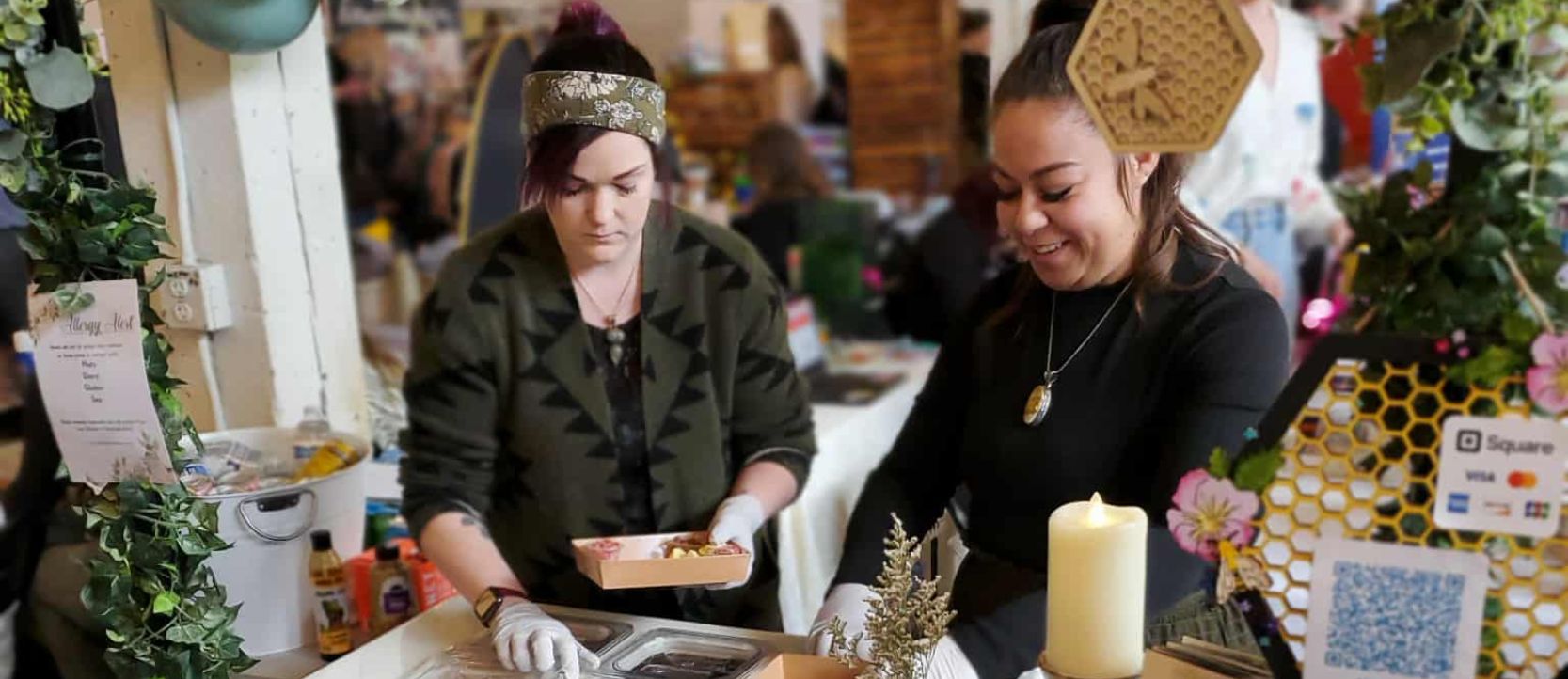 Honeybee Horticulture team at charcuterie station serving guests in Kitsap County