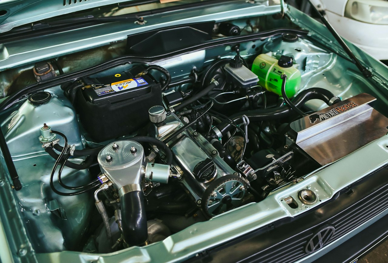 Vehicle undercarriage inspection and cleaning during detailing service