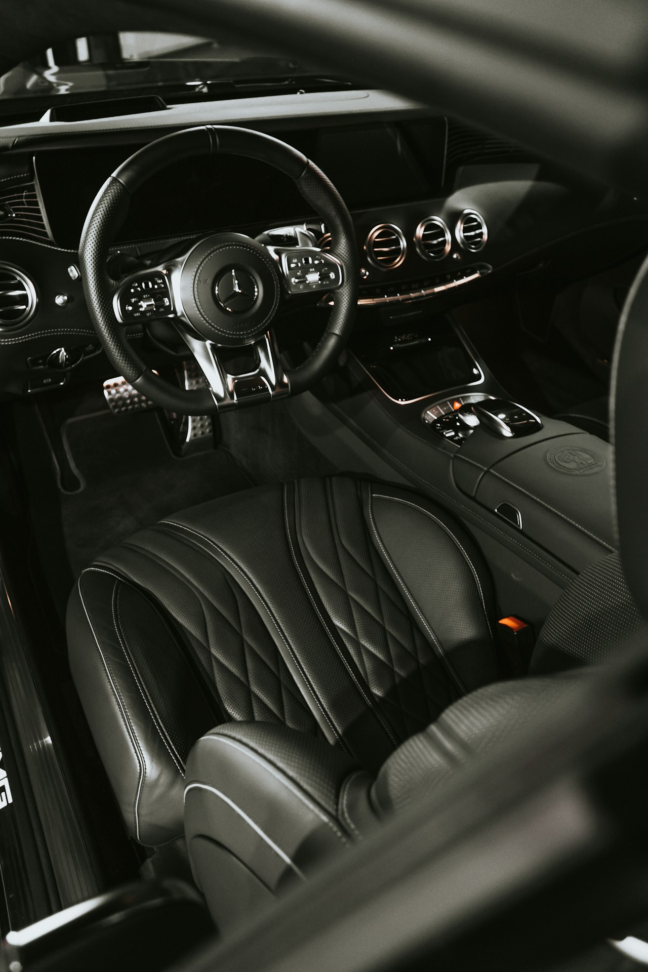 Clean, conditioned leather seats and dashboard in a detailed car interior