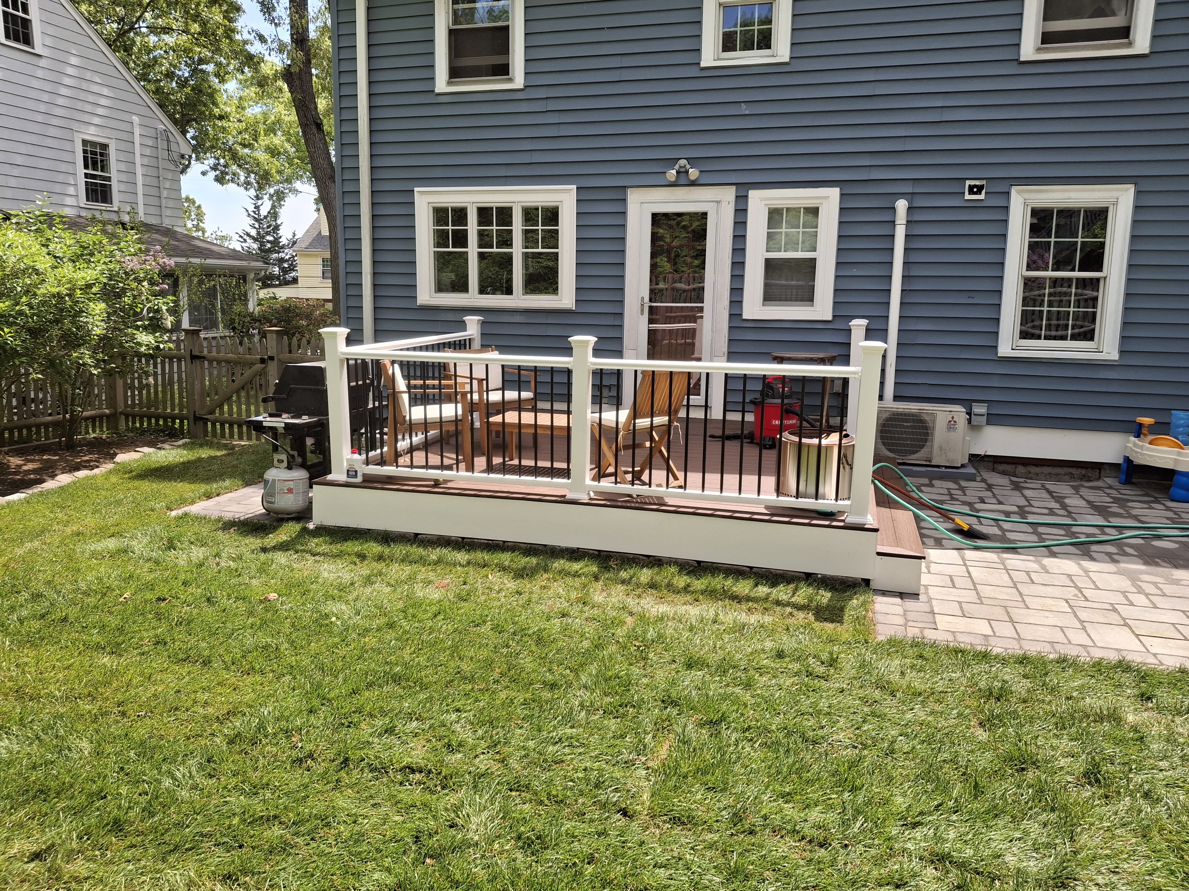Completed exterior and custom deck remodeling project