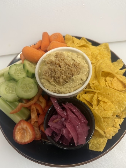 Wildhorse Bar & Grill Veggie Platter with carrots, cucumbers, bell peppers, celery, tortilla chips, dip, and pickled onions