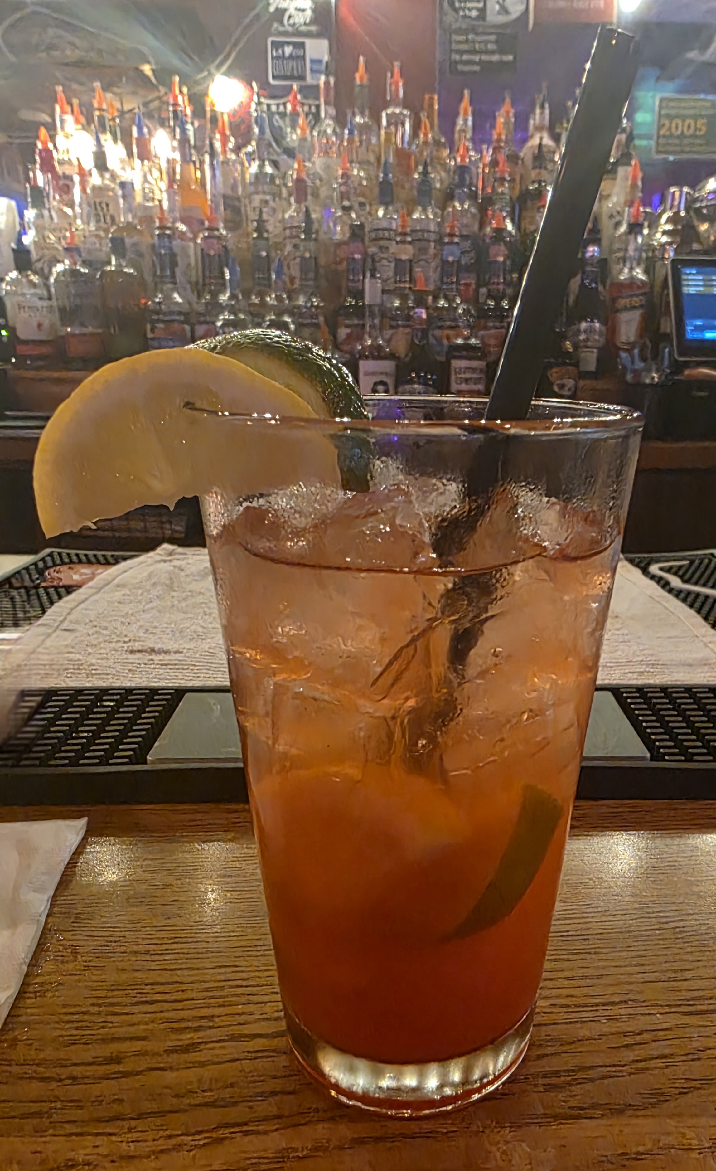Wildhorse Bar & Grill Hot Mess cocktail served tall over ice with fresh citrus garnish at the bar