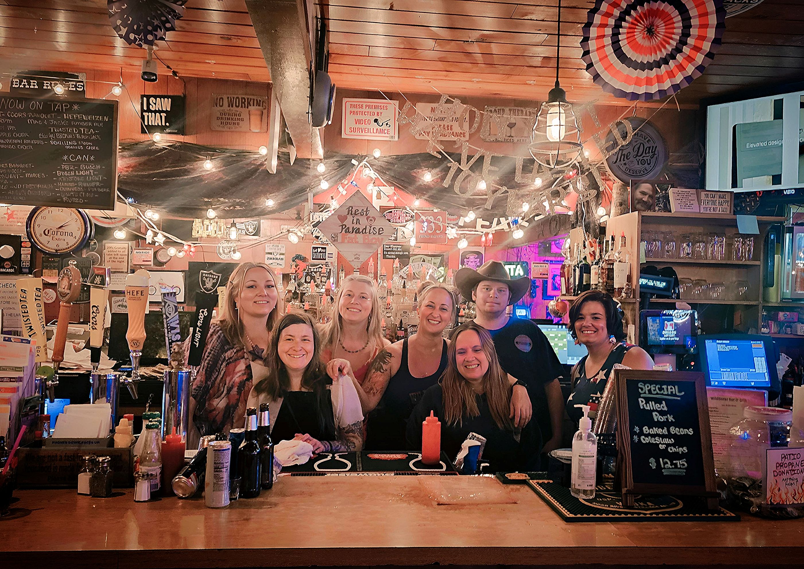 The friendly team behind the bar counter at Wildhorse Bar & Grill in Molalla, Oregon