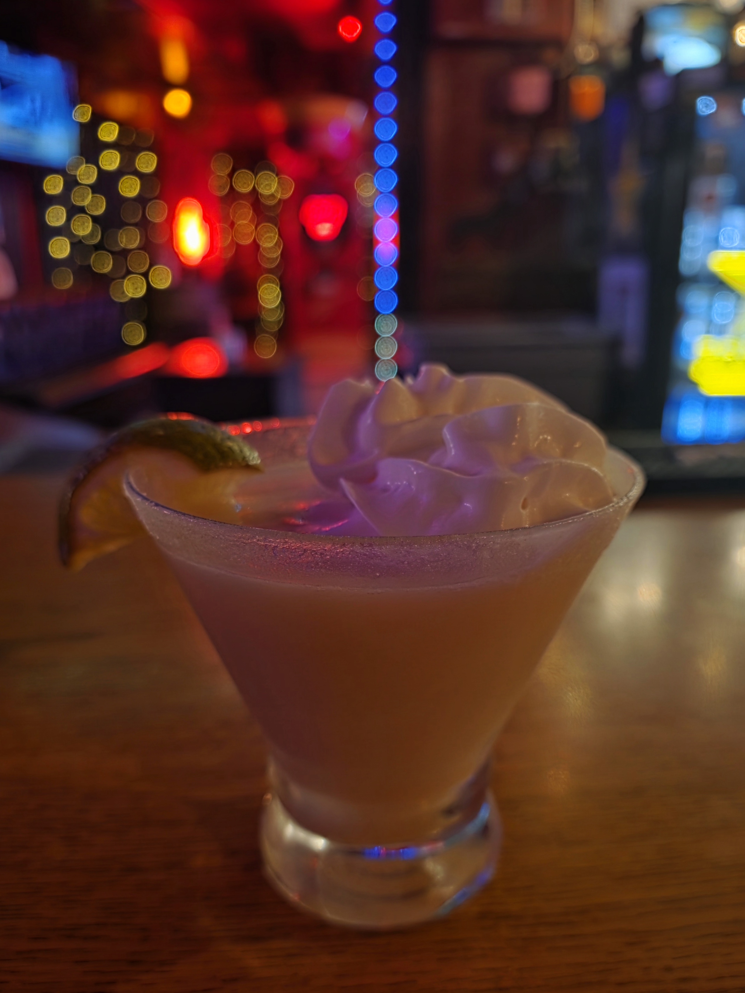 Wildhorse Bar & Grill cocktail with whipped cream on the wooden bar