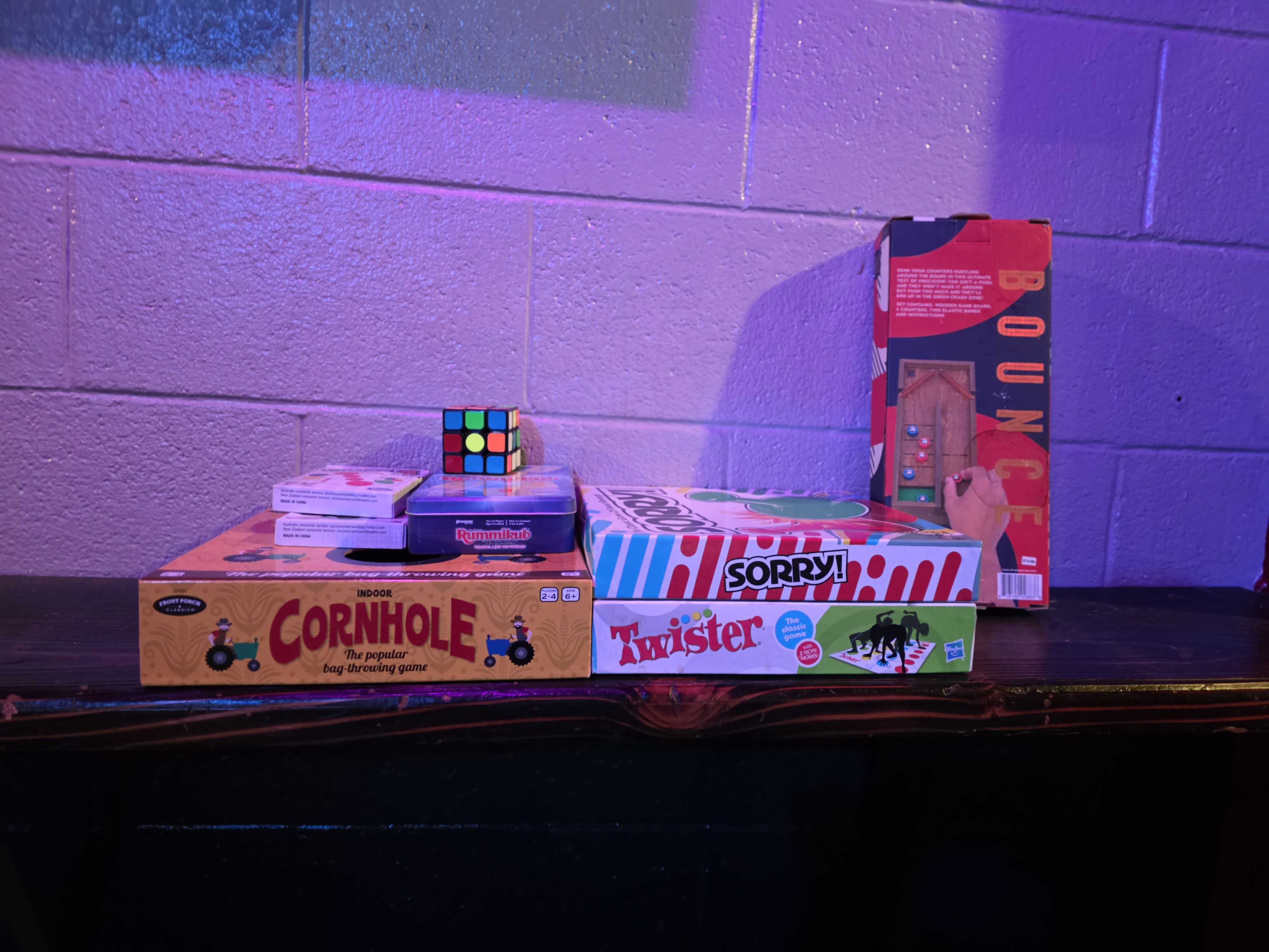 Selection of tabletop games at Wildhorse Bar & Grill including Indoor Cornhole, Sorry!, Twister, Rummikub, Rubik's cube, and Bounce