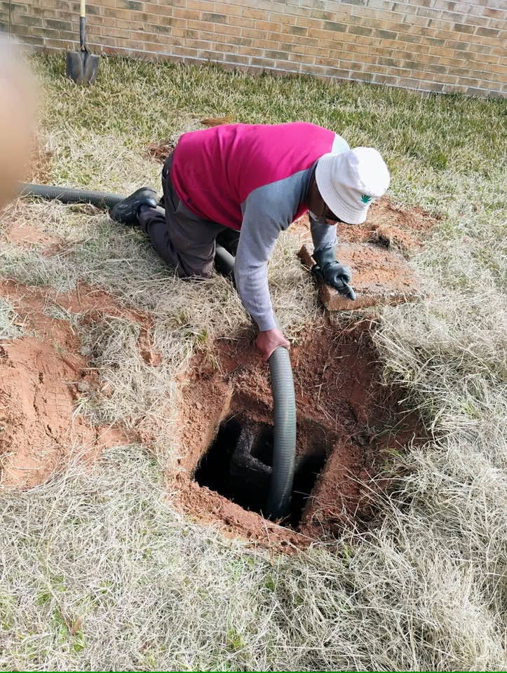 Rosier Services technician servicing and pumping a septic tank on location