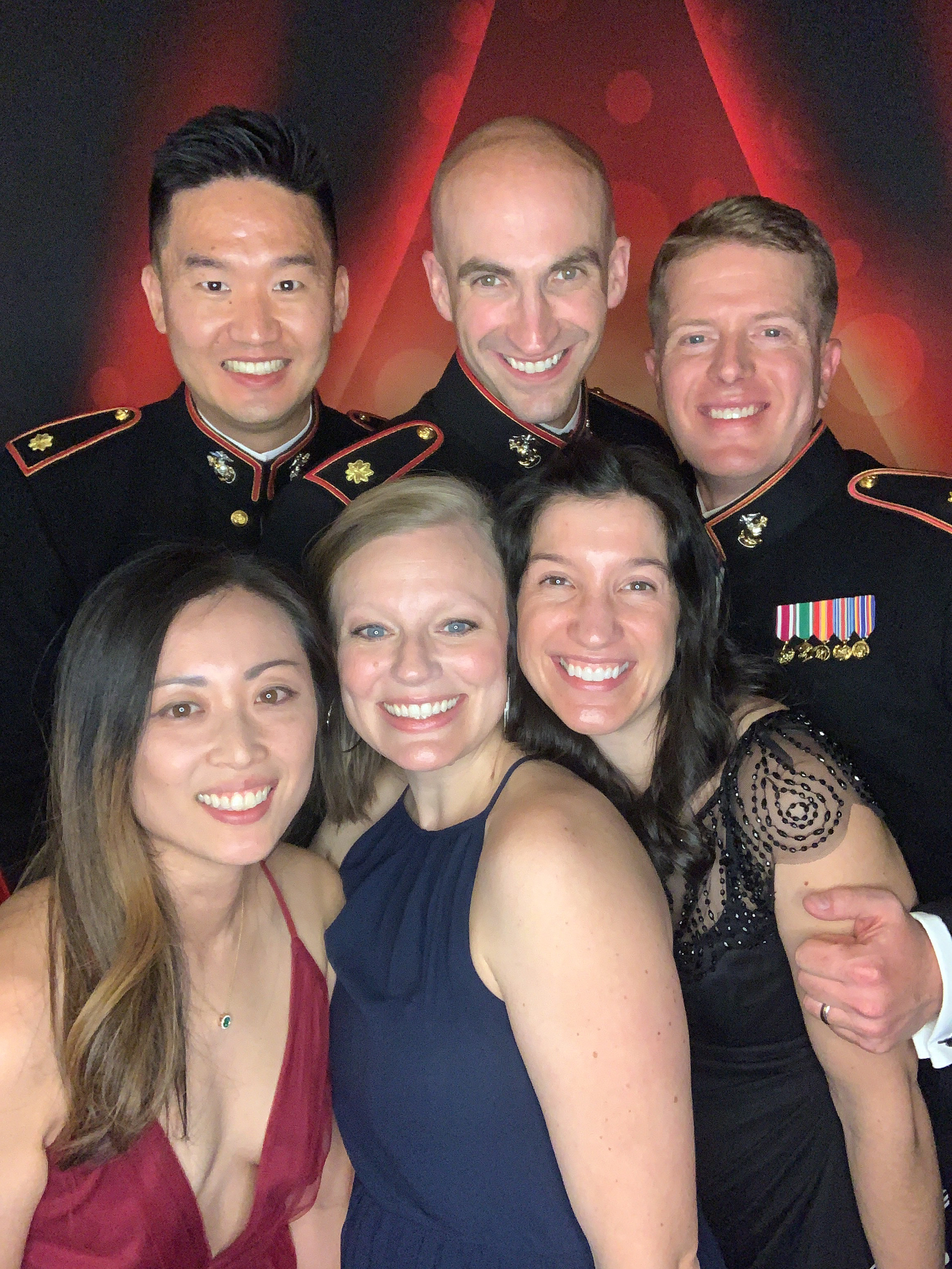 Marines in dress blue uniforms and guests celebrating at an authentic Elite360 Military Ball photo booth
