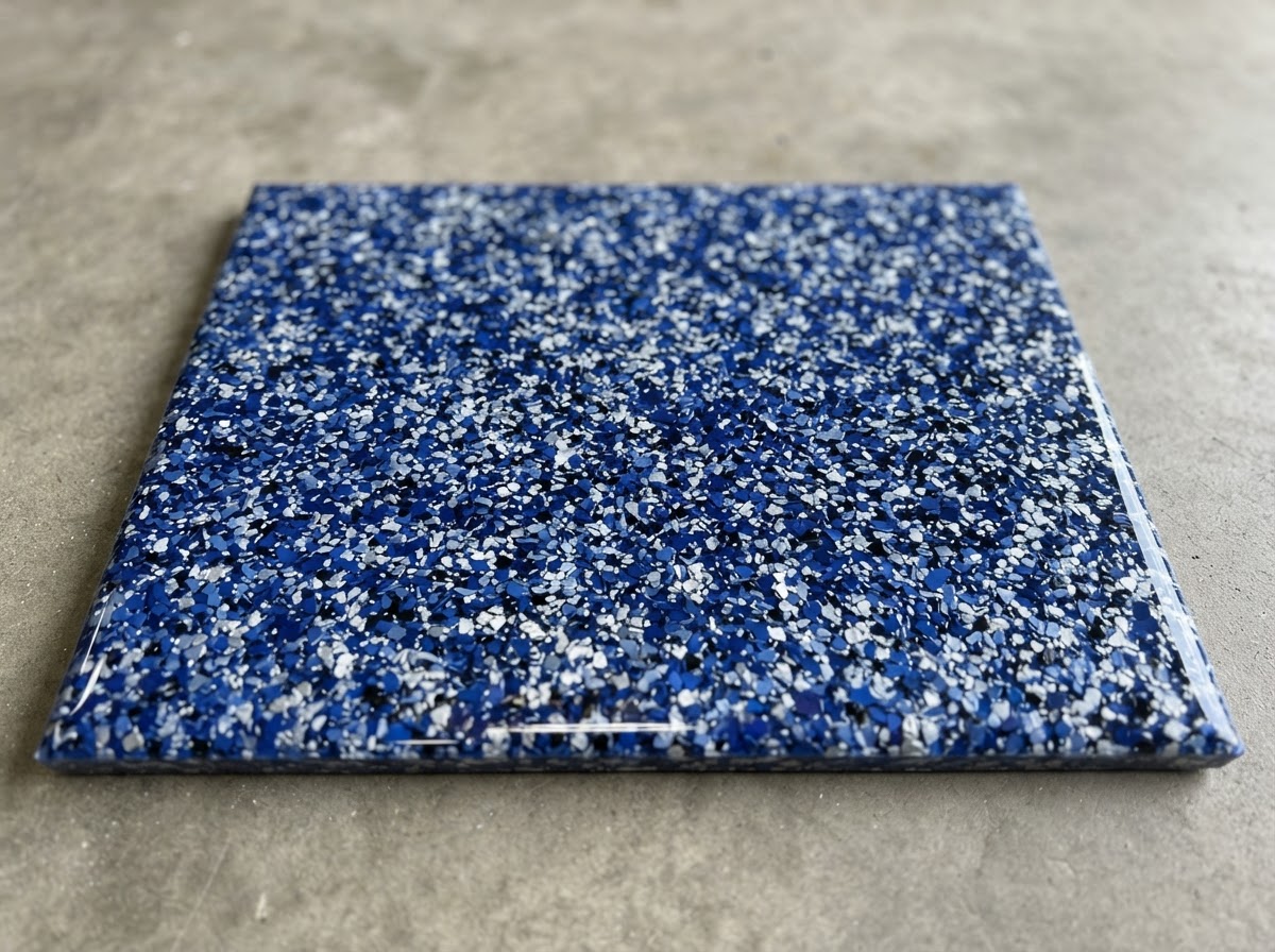 Epoxy flake floor sample in blue and silver decorative vinyl chips