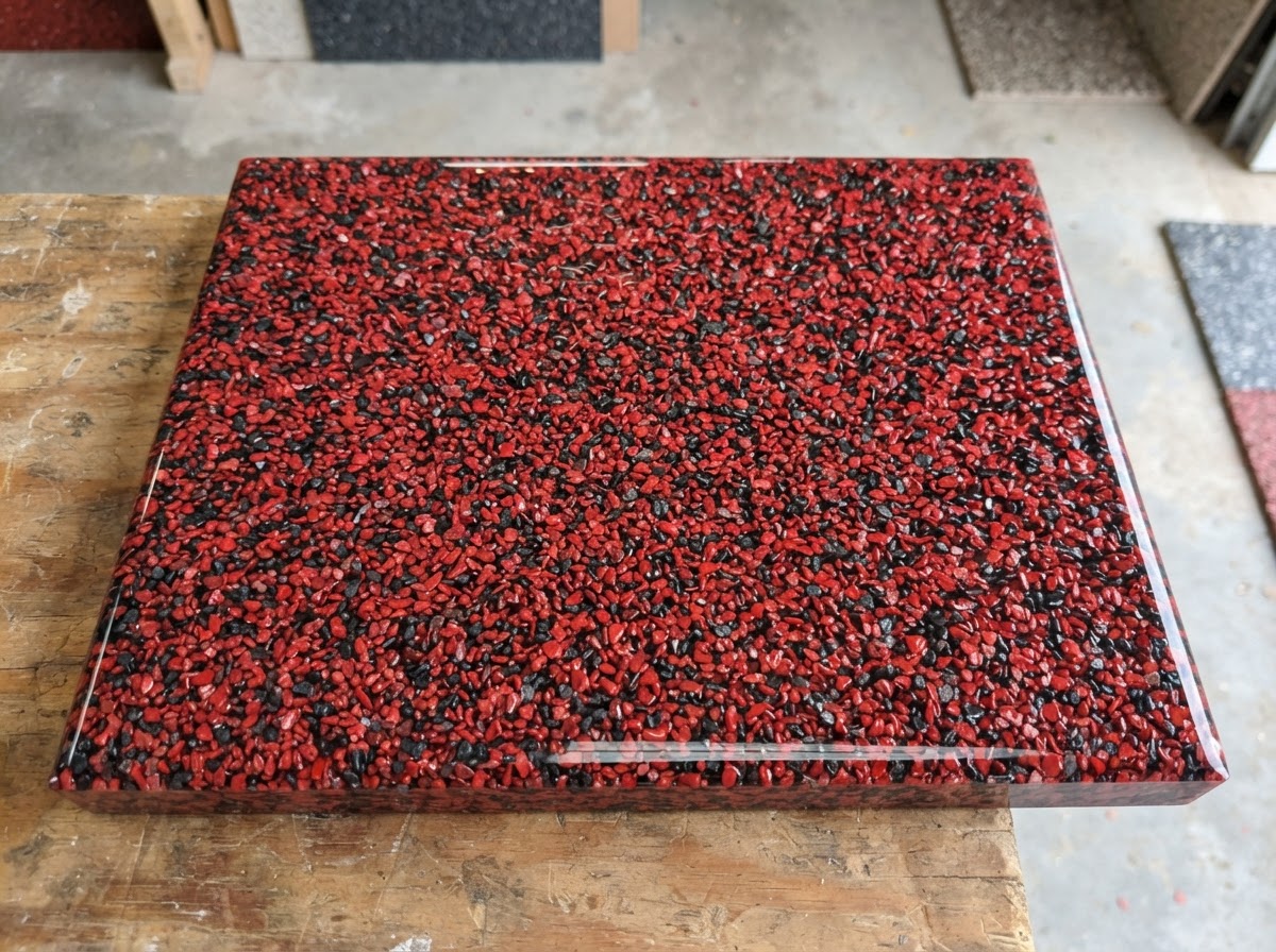 Quartz aggregate epoxy floor sample in red and charcoal granules