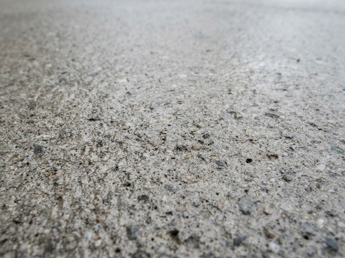 Close-up of a sealed concrete surface texture with protective sealer