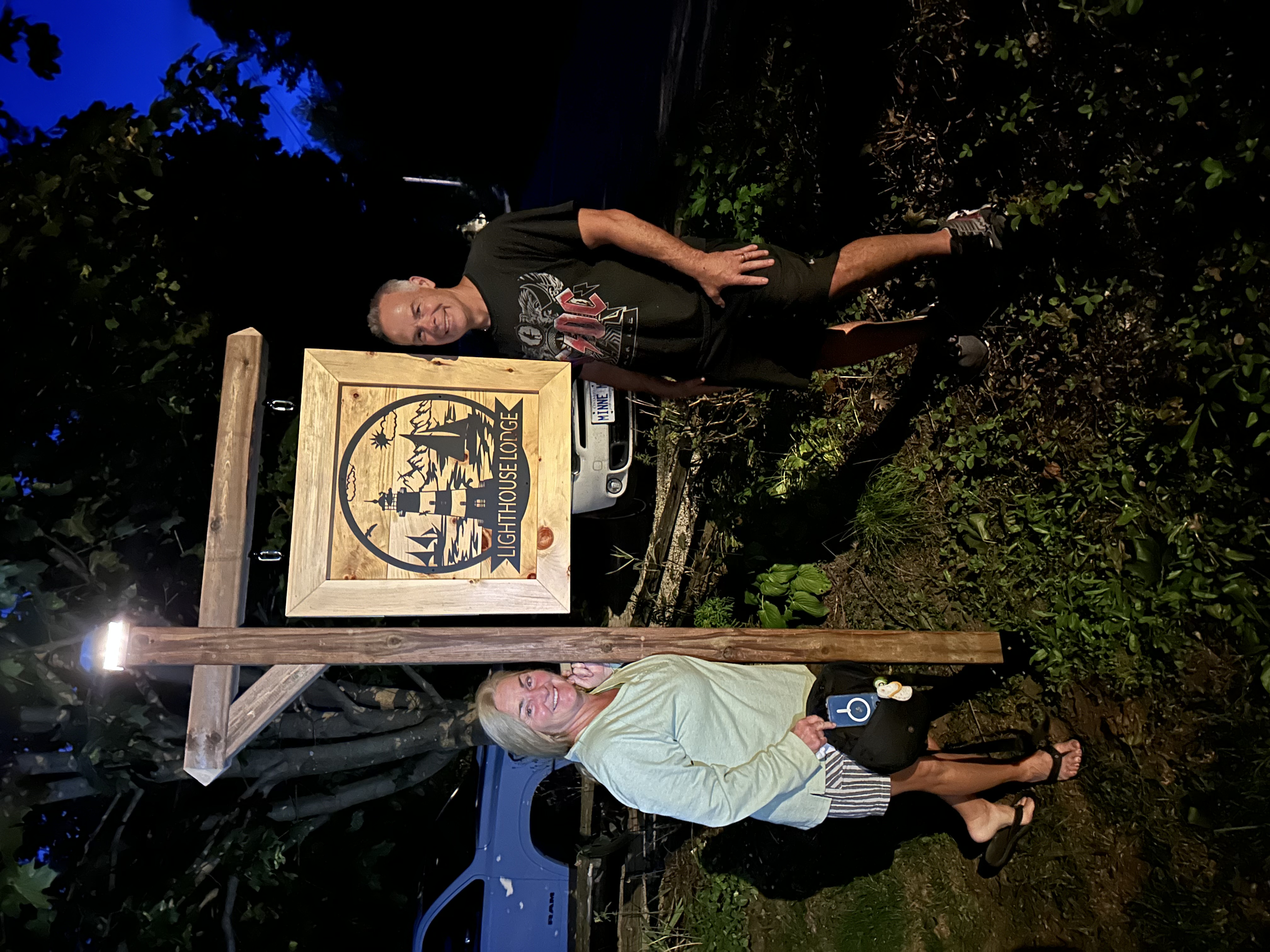 Handcrafted Lighthouse Lodge wooden entrance sign