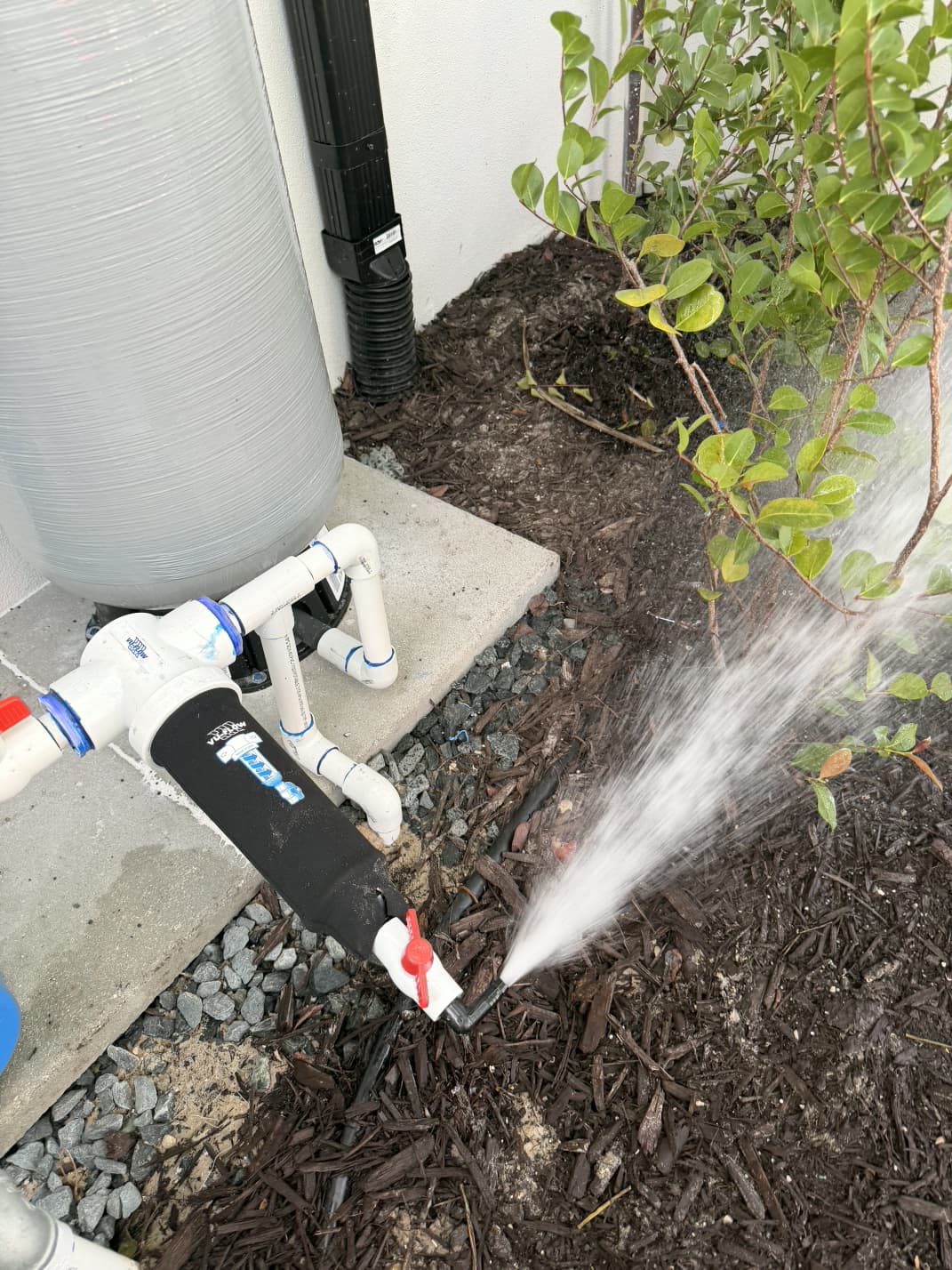 Vu-Flow spin-down sediment filter flush valve test in landscape bed by Aenlle Home Service LLC