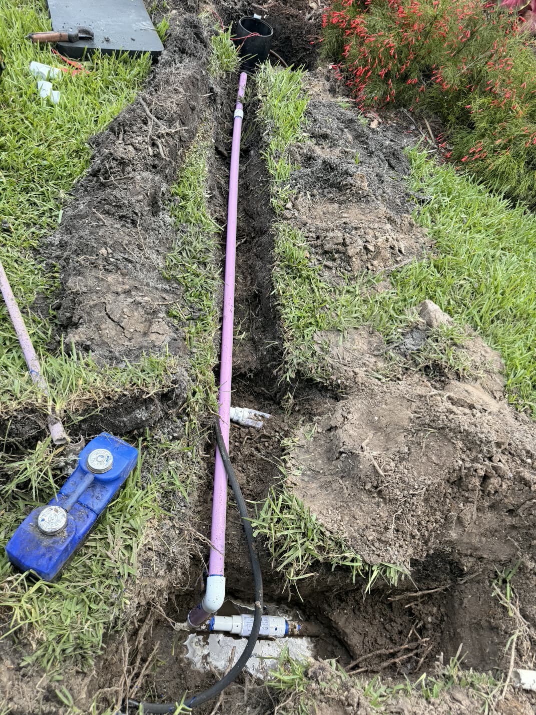 irrigation trench with purple reclaimed water PVC pipe and electronic valve locator receiver by Aenlle Home Service LLC