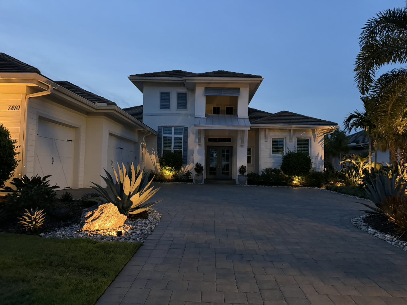 luxury Florida home exterior low-voltage architectural and landscape lighting by Aenlle Home Service LLC