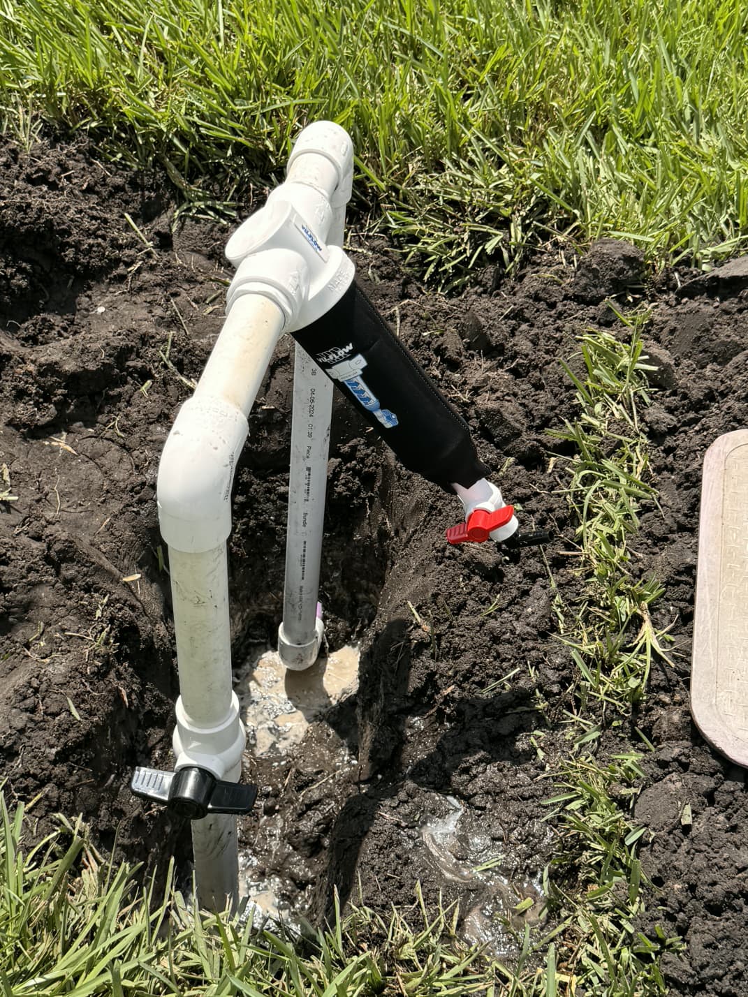 in-ground Vu-Flow filter manifold and ball valves installed on residential turf