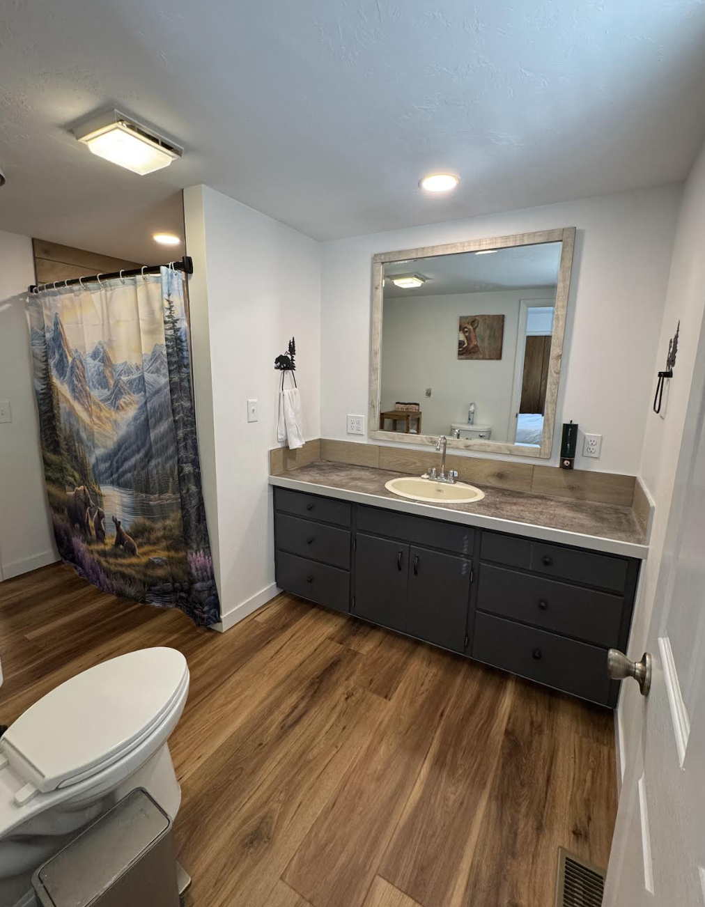 Spacious bathroom vanity with wide mirror