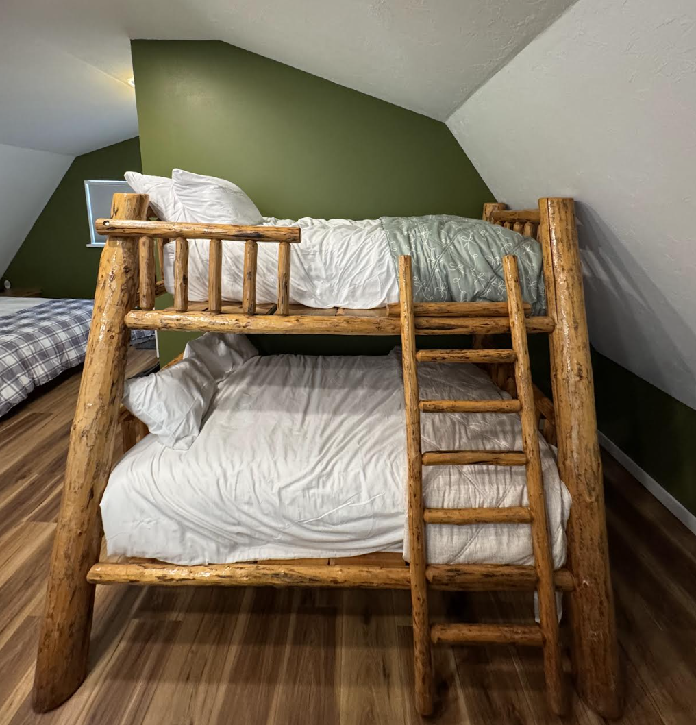 Handmade log bunk bed in the bedroom