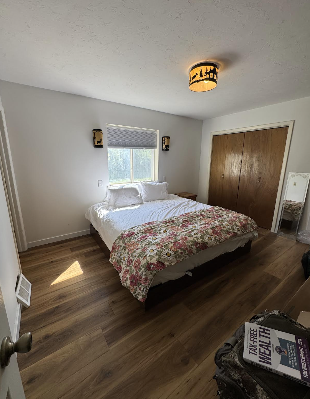 Inviting master bedroom with King bed and rustic Idaho details