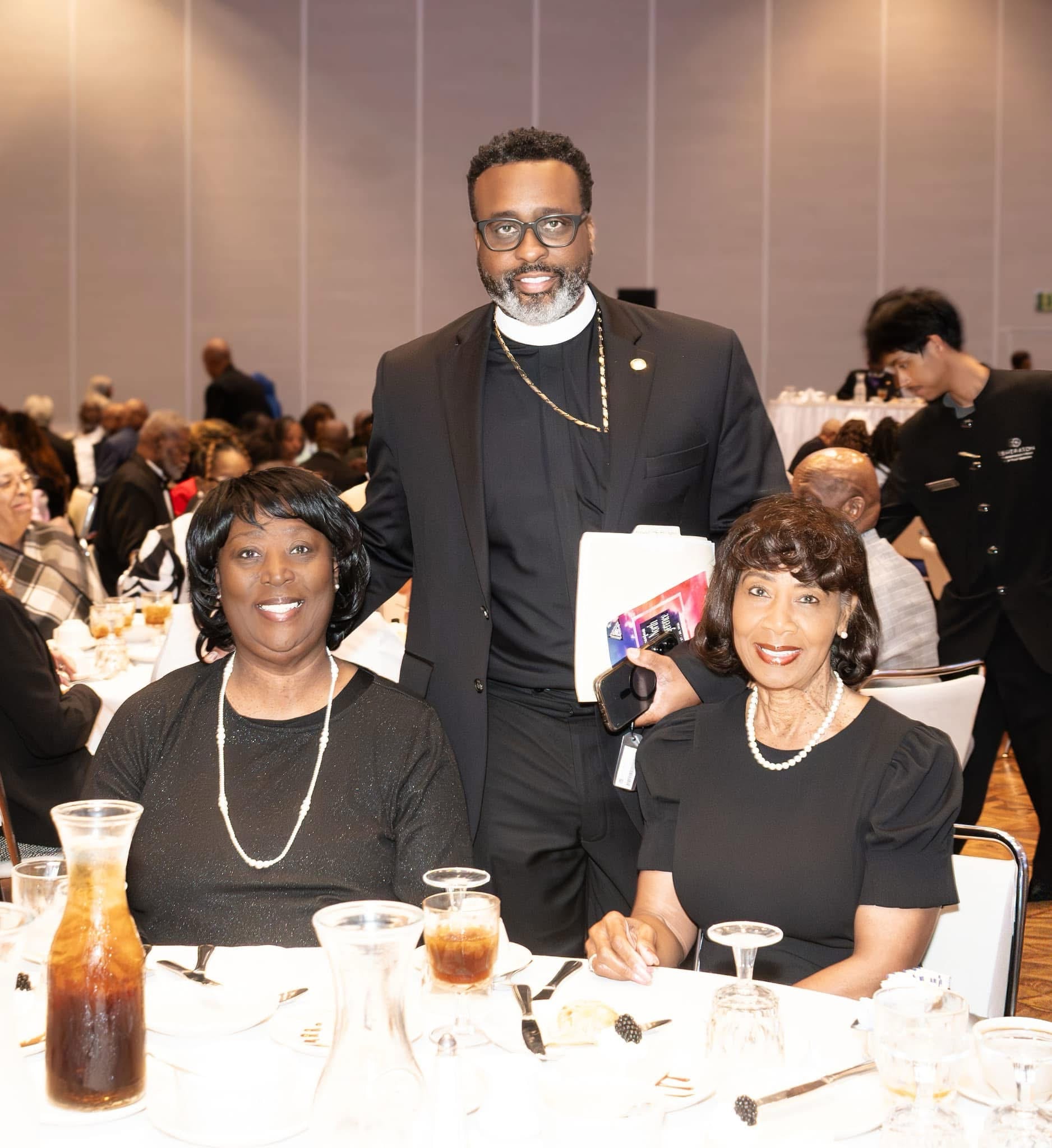 Pastor Freeman with Trinity AME Zion church family members