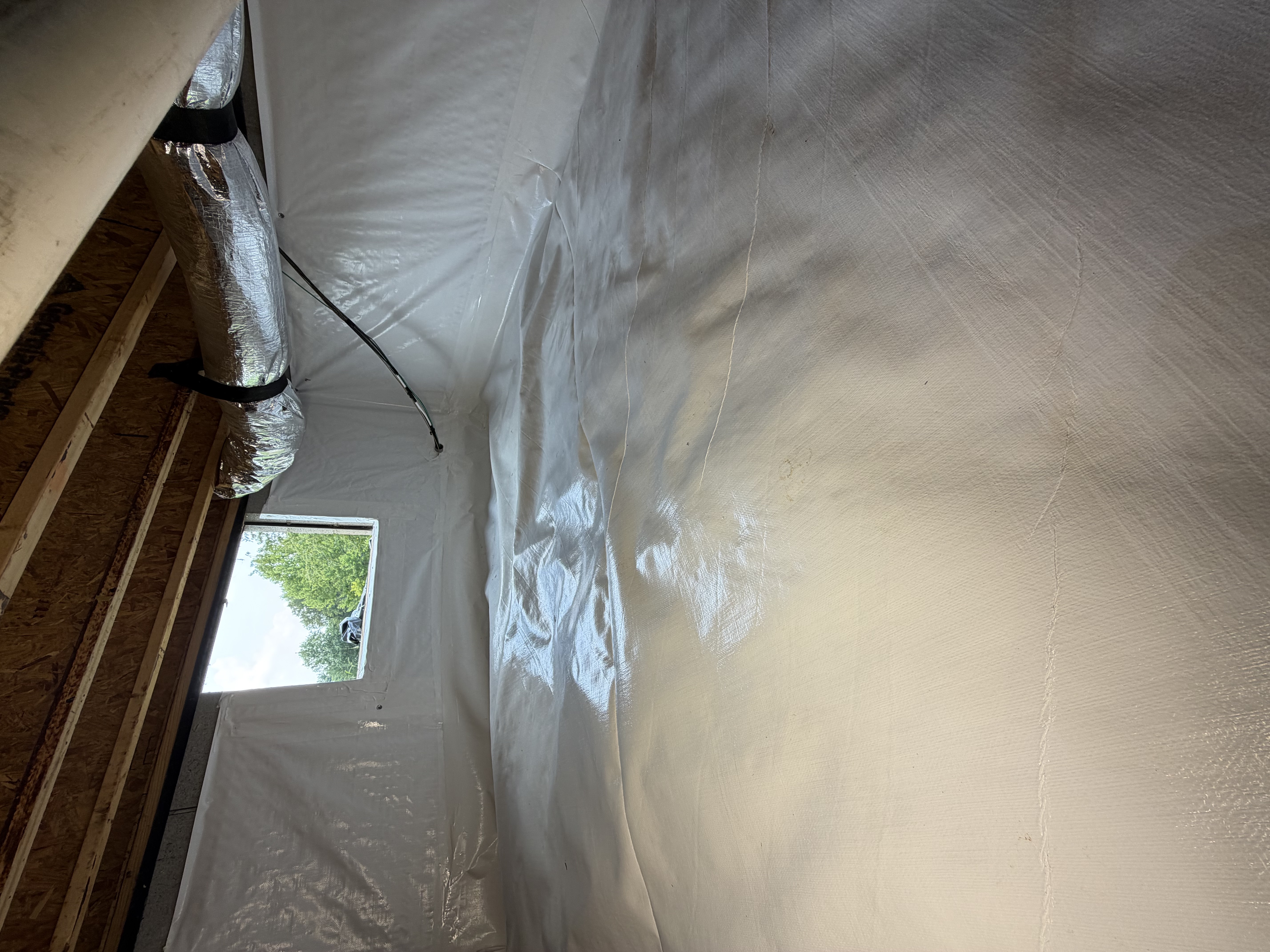 Crawl space repair and clean vapor barrier installation by Crawlspace Hero
