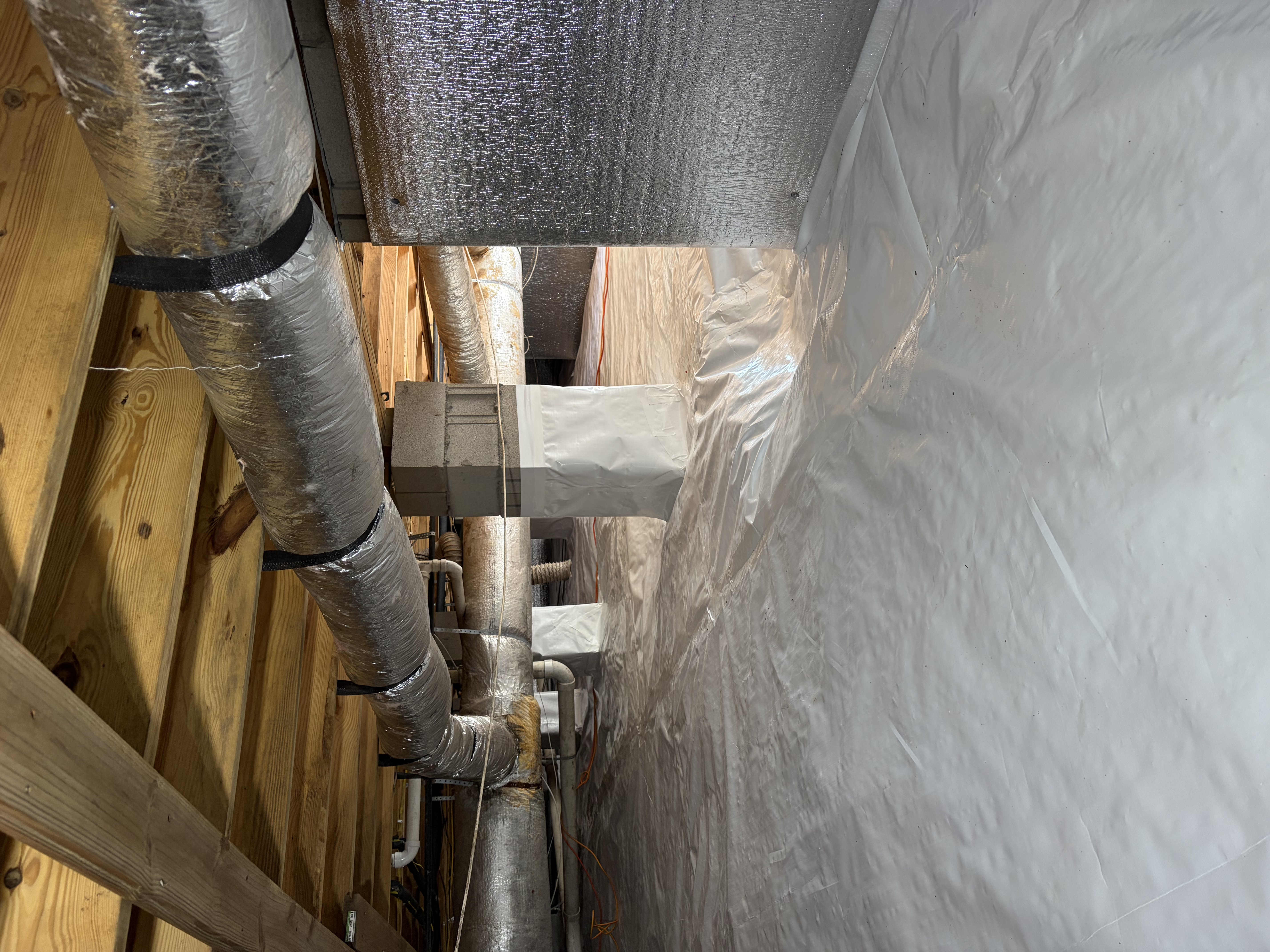 Crawl space repair with sealed vapor barrier and insulated ductwork by Crawlspace Hero
