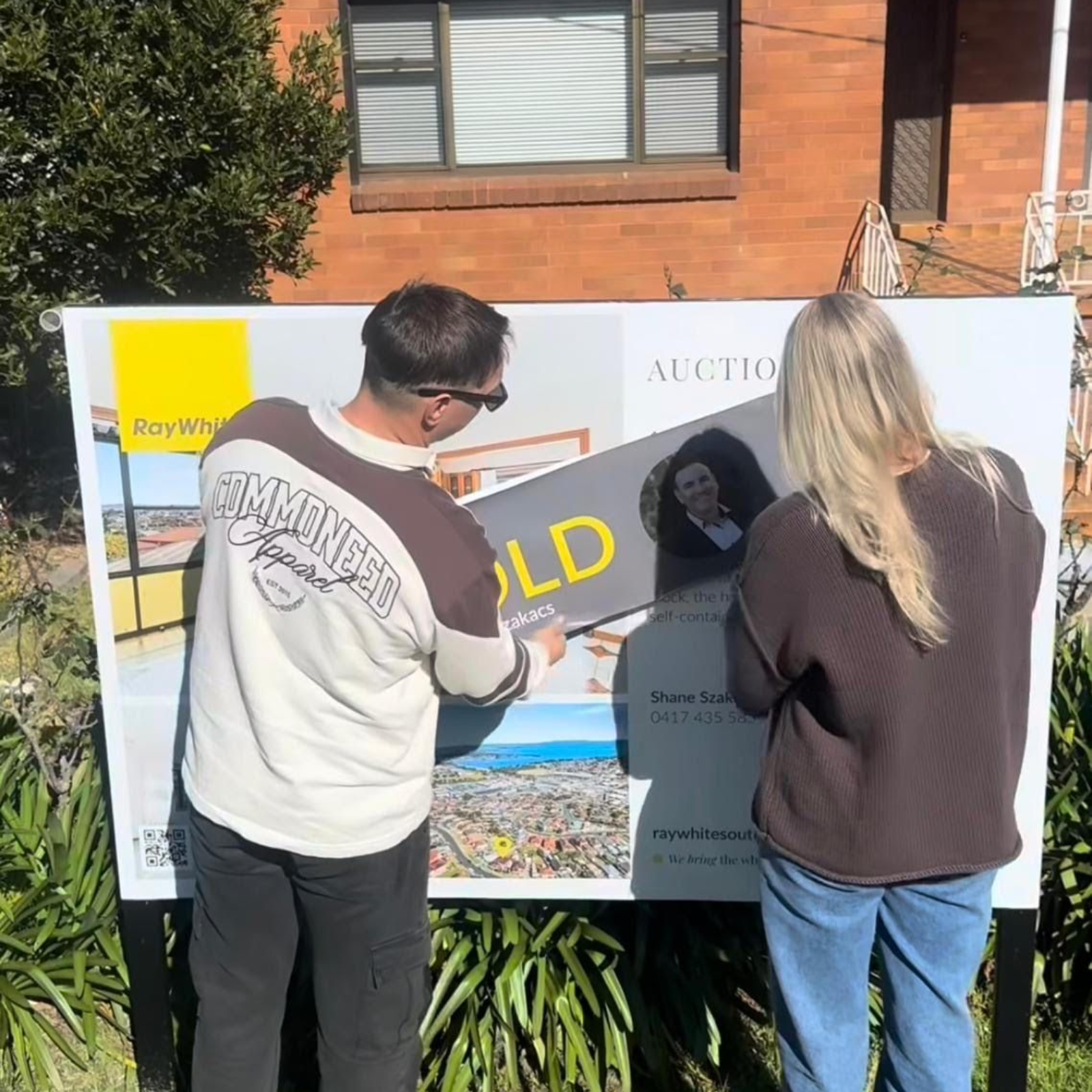 Power Property Buyers client celebrating a SOLD auction win on the Illawarra coast