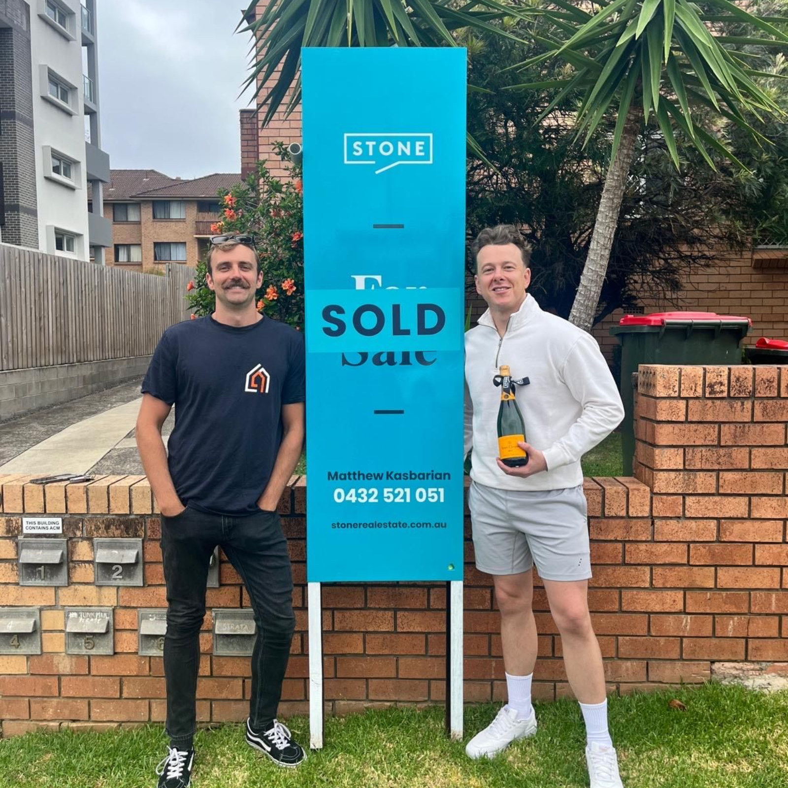 Power Property Buyers clients celebrating a SOLD sign outside their new property