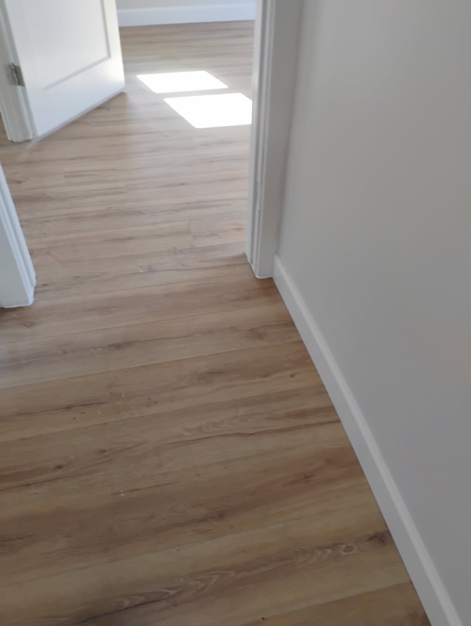 Luxury Vinyl Plank (LVP) Flooring & Baseboard Trim