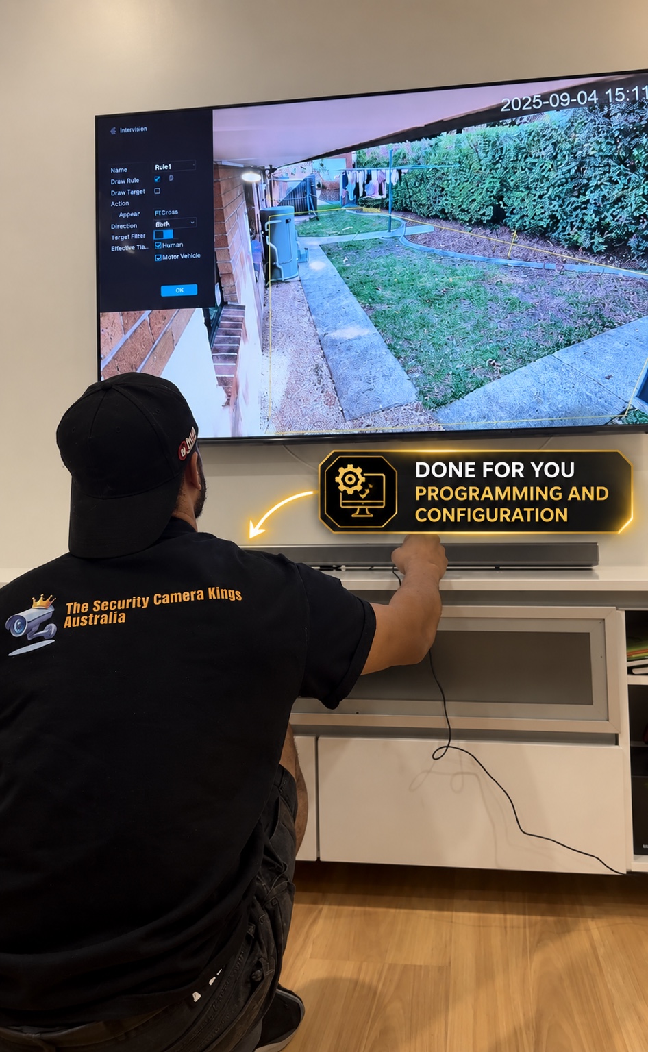 Authentic SCKA technician configuring security camera and intrusion system on customer's television