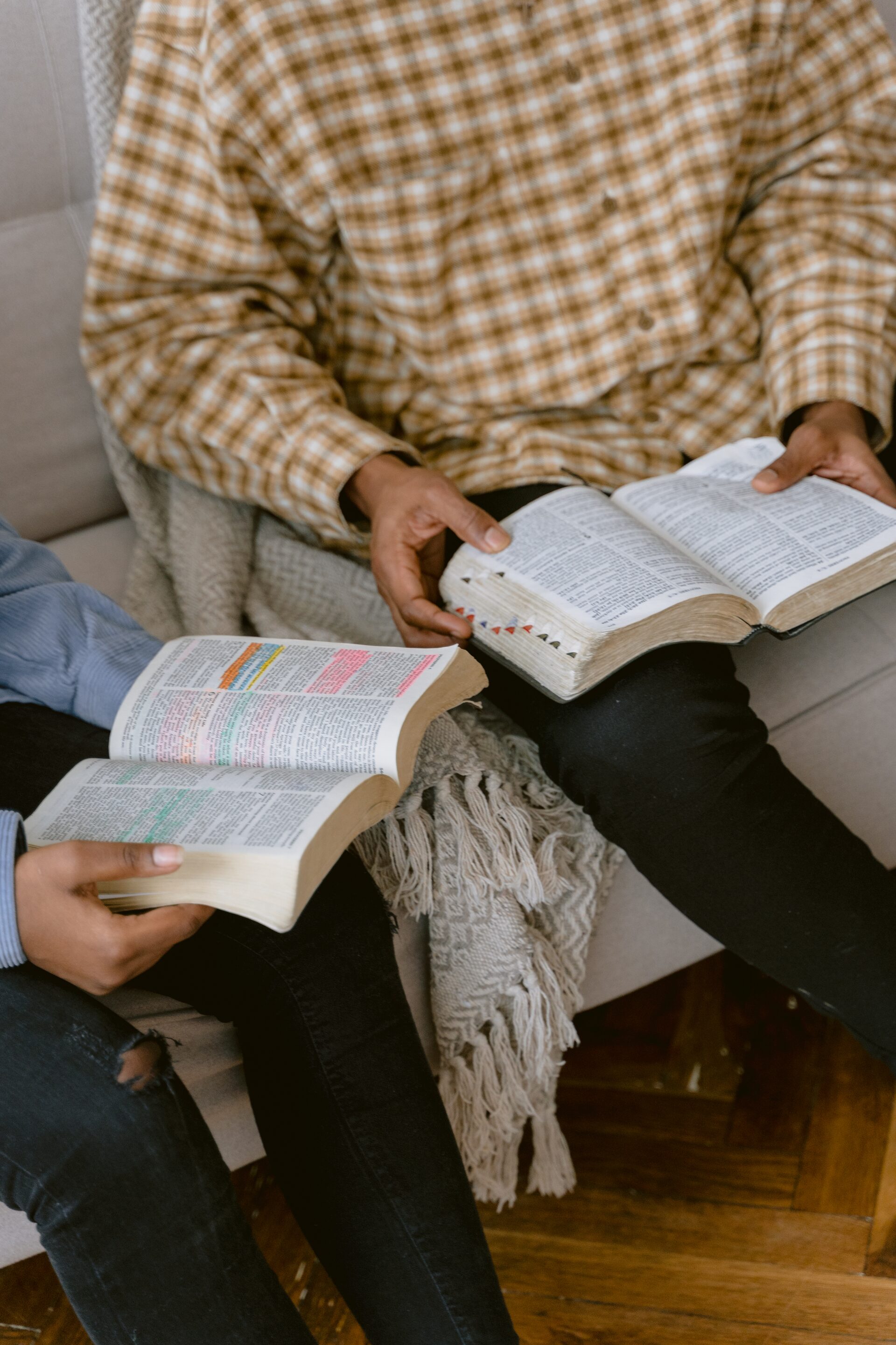Two people reading the Bible together