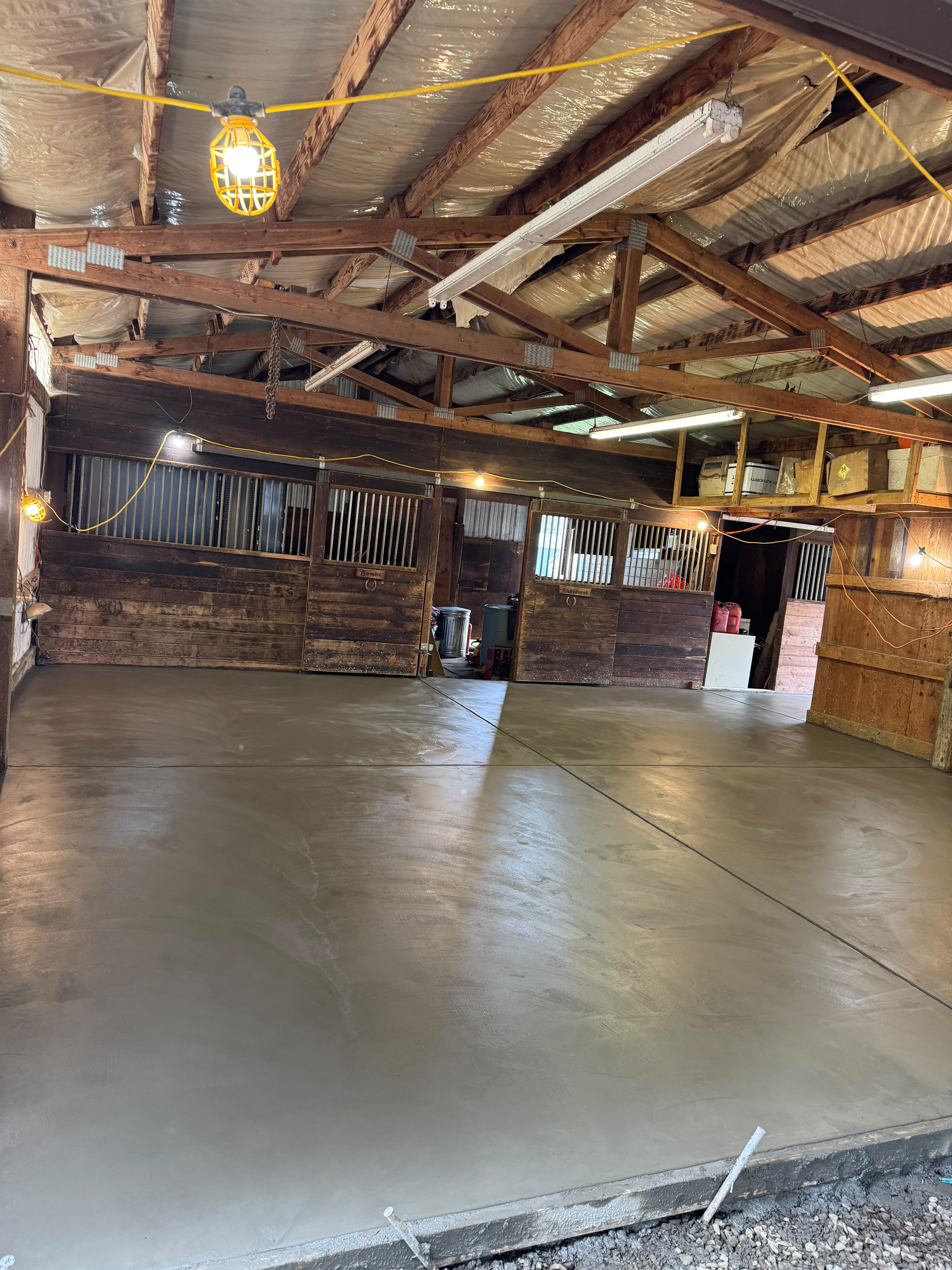 interior equestrian barn and livestock stall concrete floor pour with smooth finish in Silverton OR by Foothills Concrete LLC