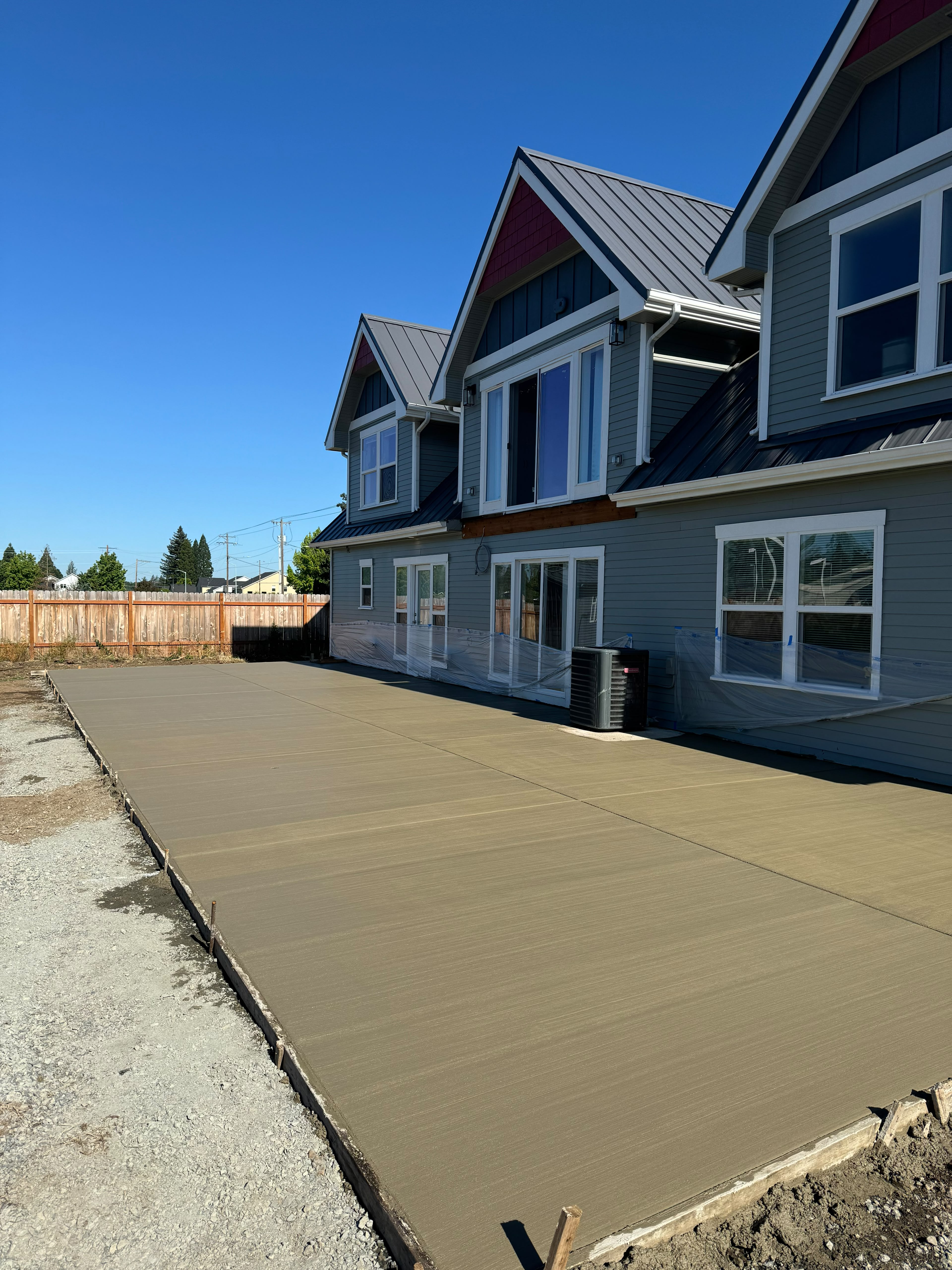 Custom outdoor concrete patio and backyard entertaining area built by Foothills Concrete LLC Salem Oregon