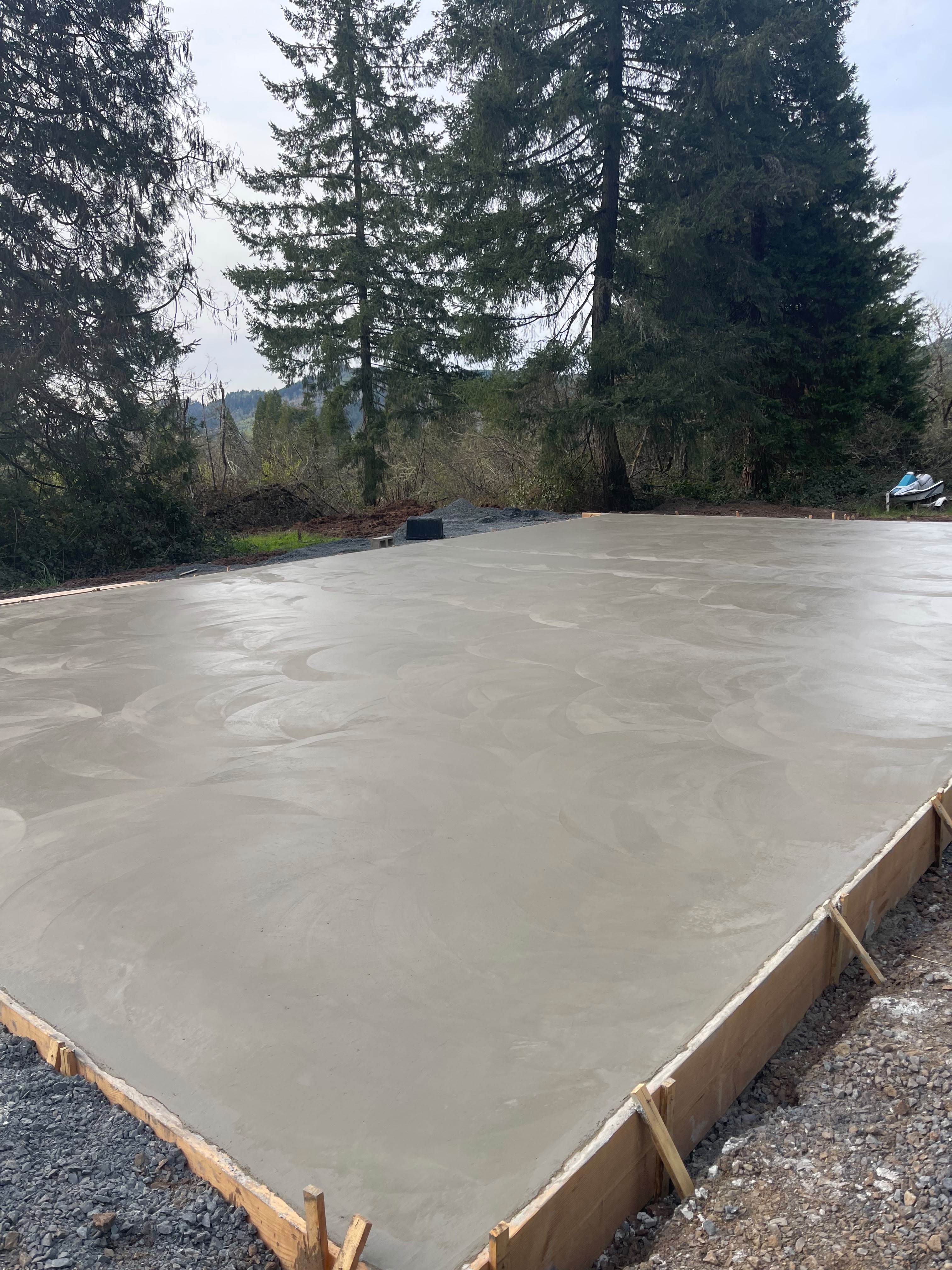 engineered shop concrete slab with decorative hand-troweled swirl texture finish by Foothills Concrete LLC in Silverton OR