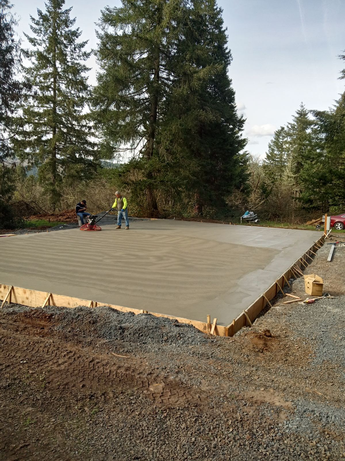 commercial workshop concrete pad pour and power trowel machine finishing in Salem Oregon by Foothills Concrete LLC