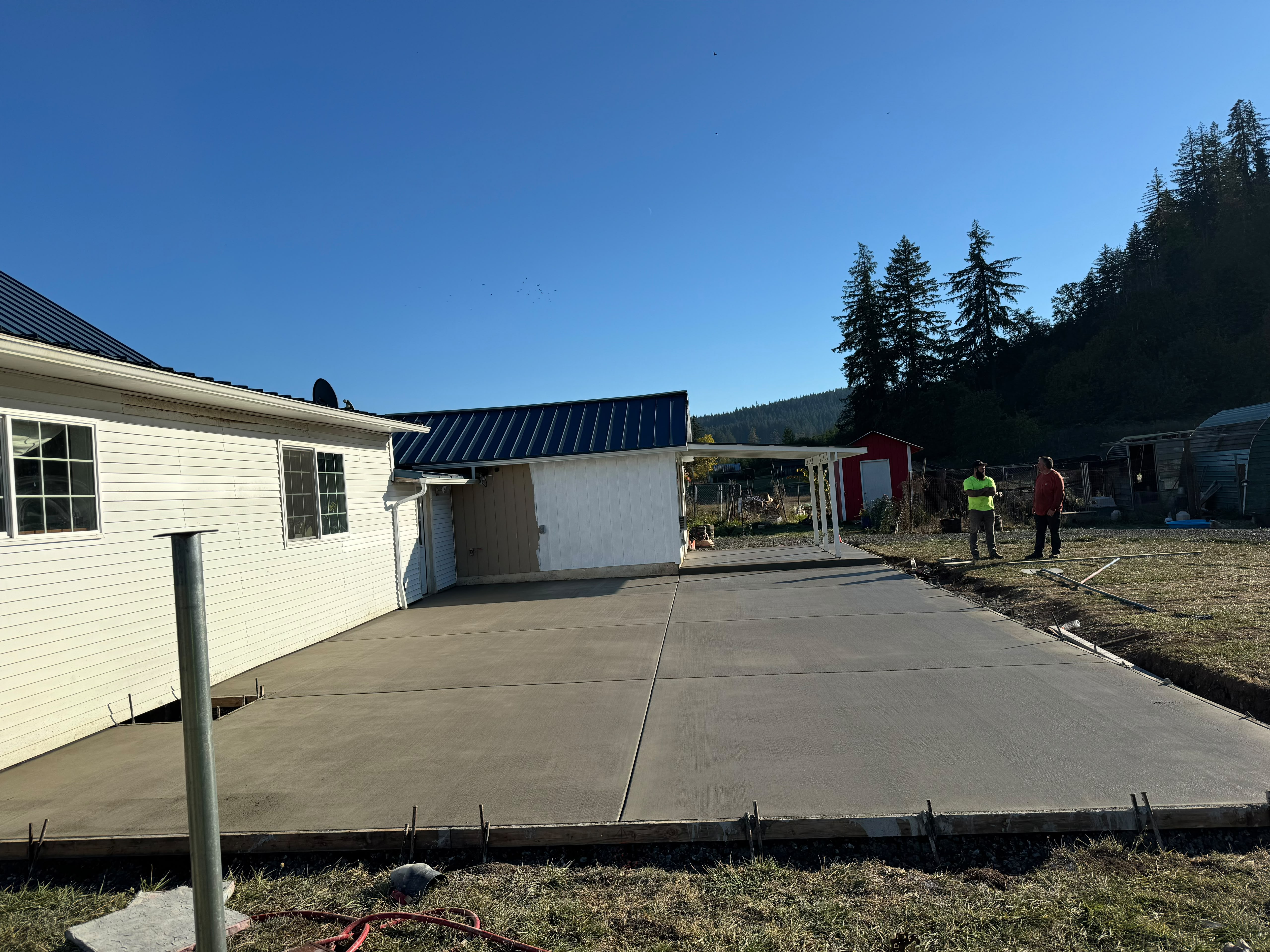 large residential backyard concrete patio extension and outdoor living pad poured in Dallas Oregon by Foothills Concrete LLC