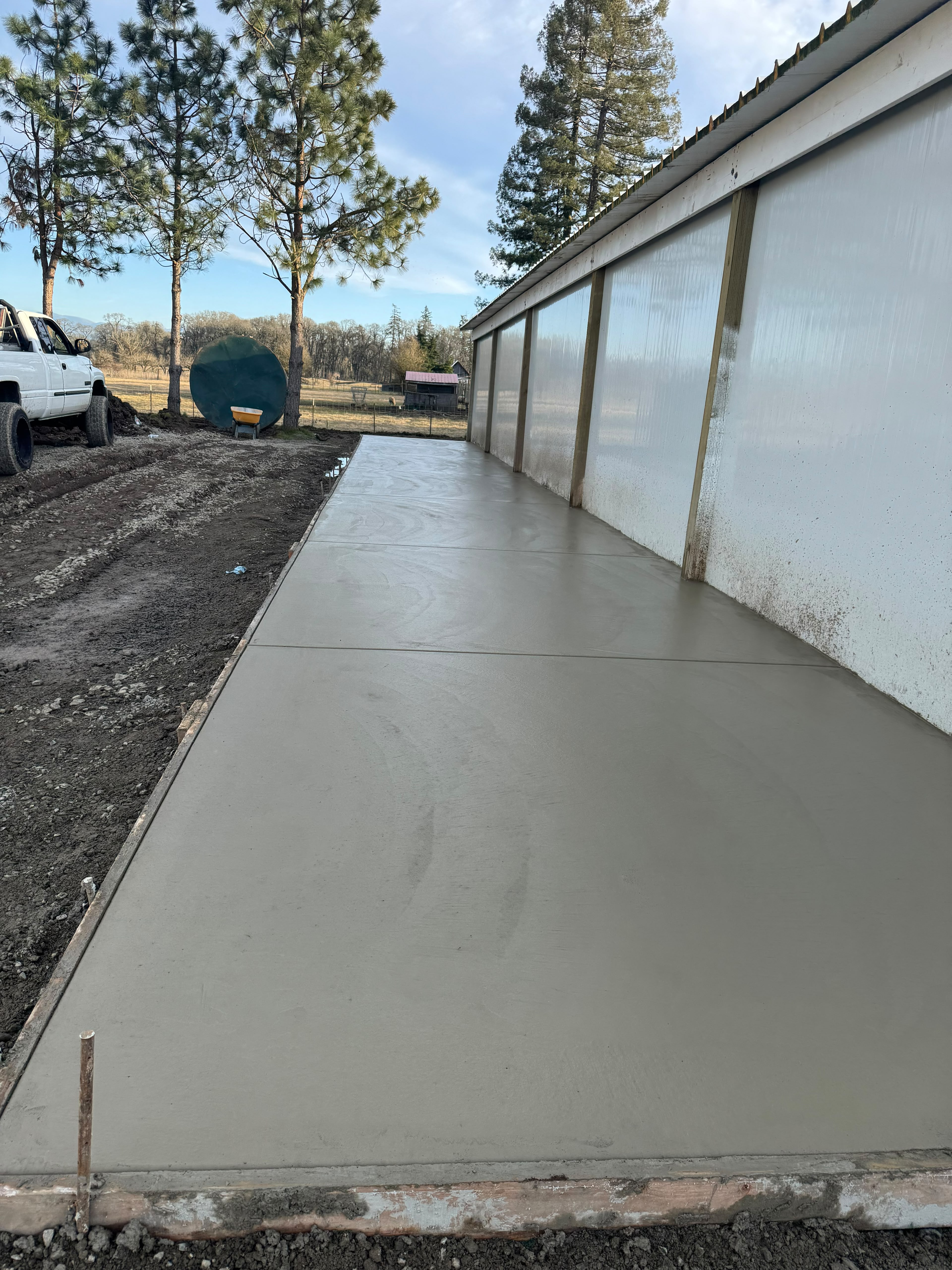rural agricultural shop concrete apron walkway with control joints poured in Salem Oregon by Foothills Concrete LLC
