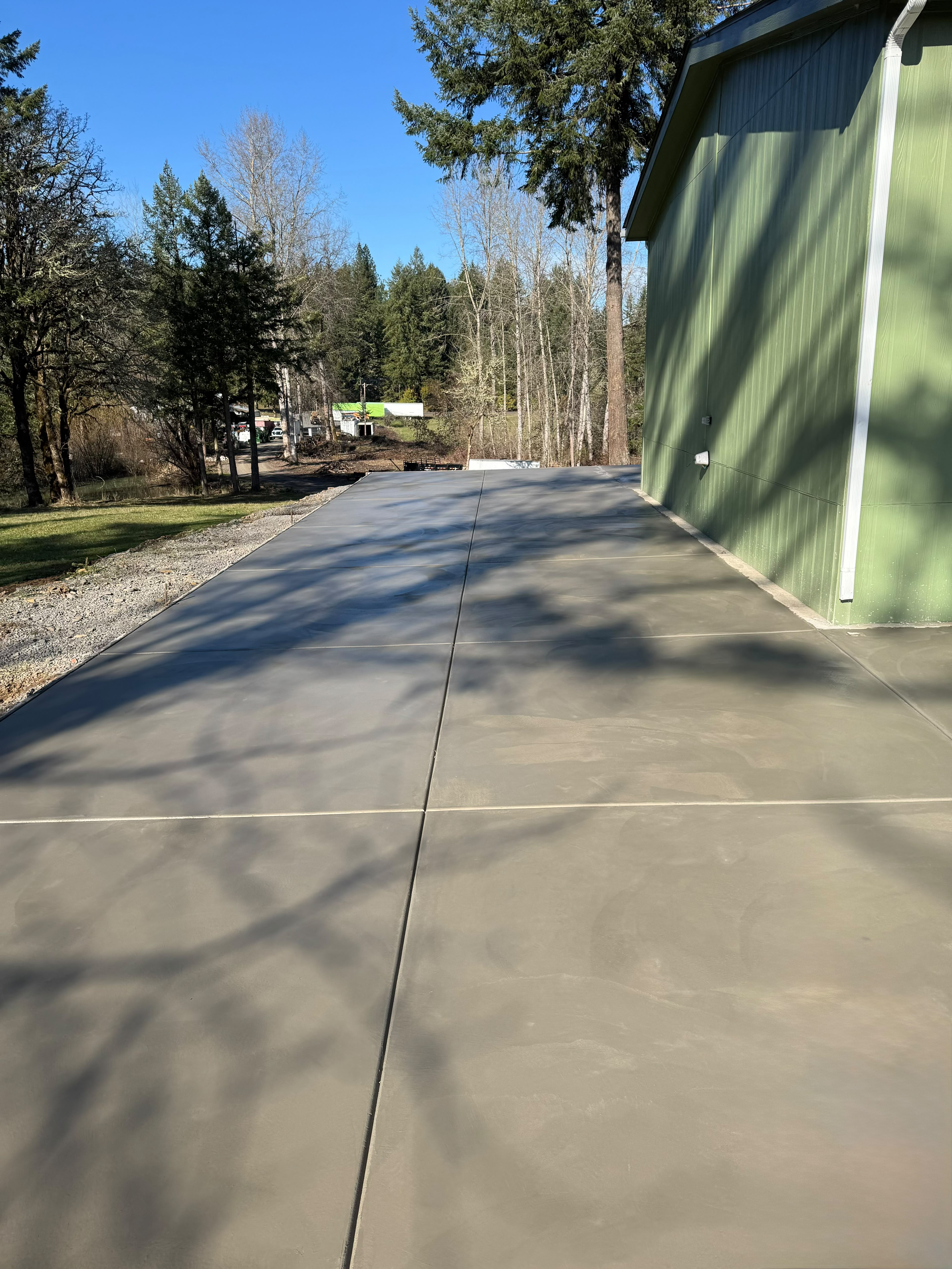 long commercial outbuilding concrete driveway and equipment parking pad completed by Foothills Concrete LLC in Salem OR
